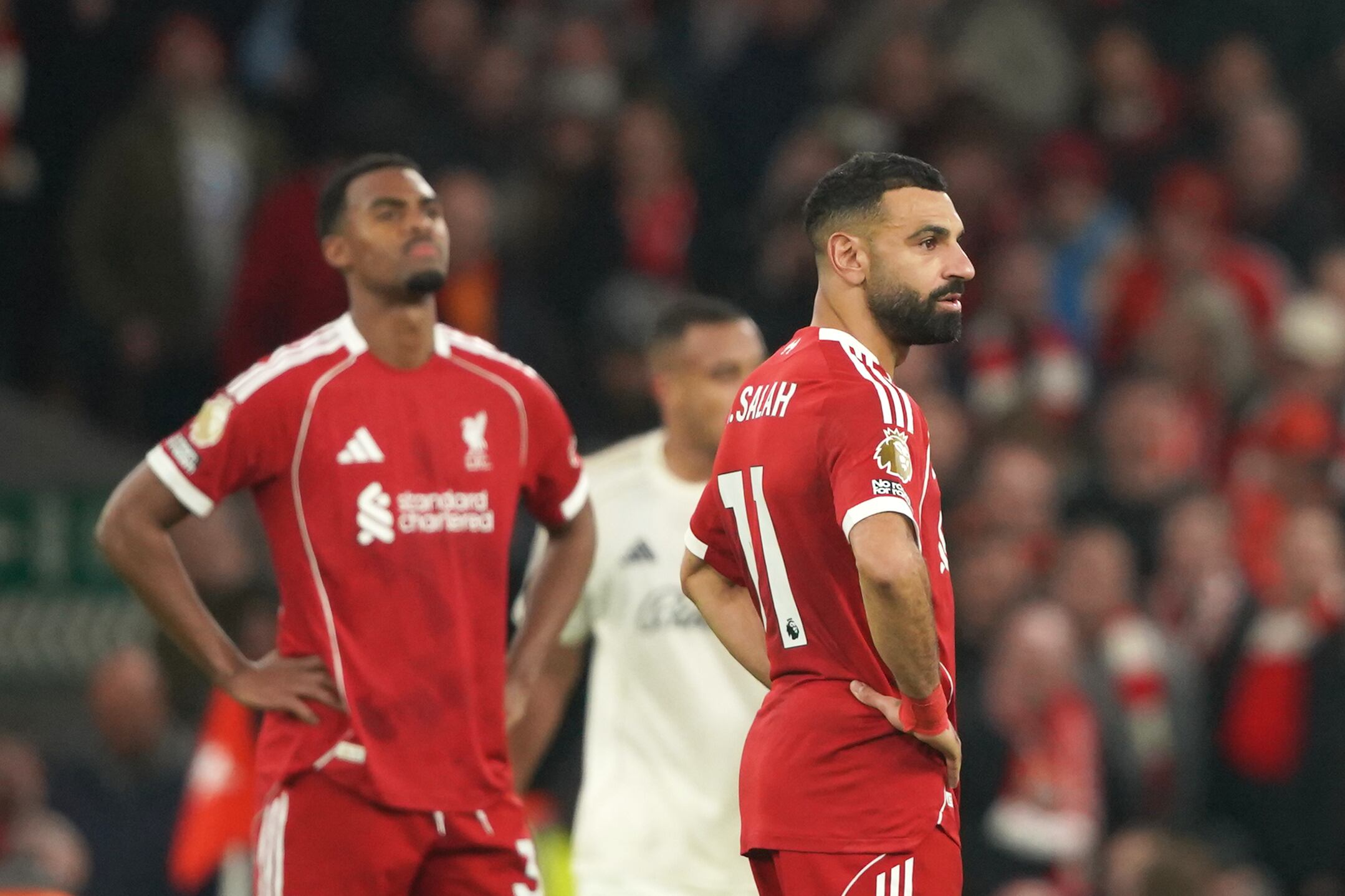 Liverpool's Mohamed Salah, right, and Ryan Gravenberch react after Nottingham Forest's Morgan Gibbs-White scored his side's third goal during the English Premier League soccer match between Liverpool and Nottingham Forest in Liverpool, England, Saturday, Nov. 22, 2025. (AP Photo/Ian Hodgson)