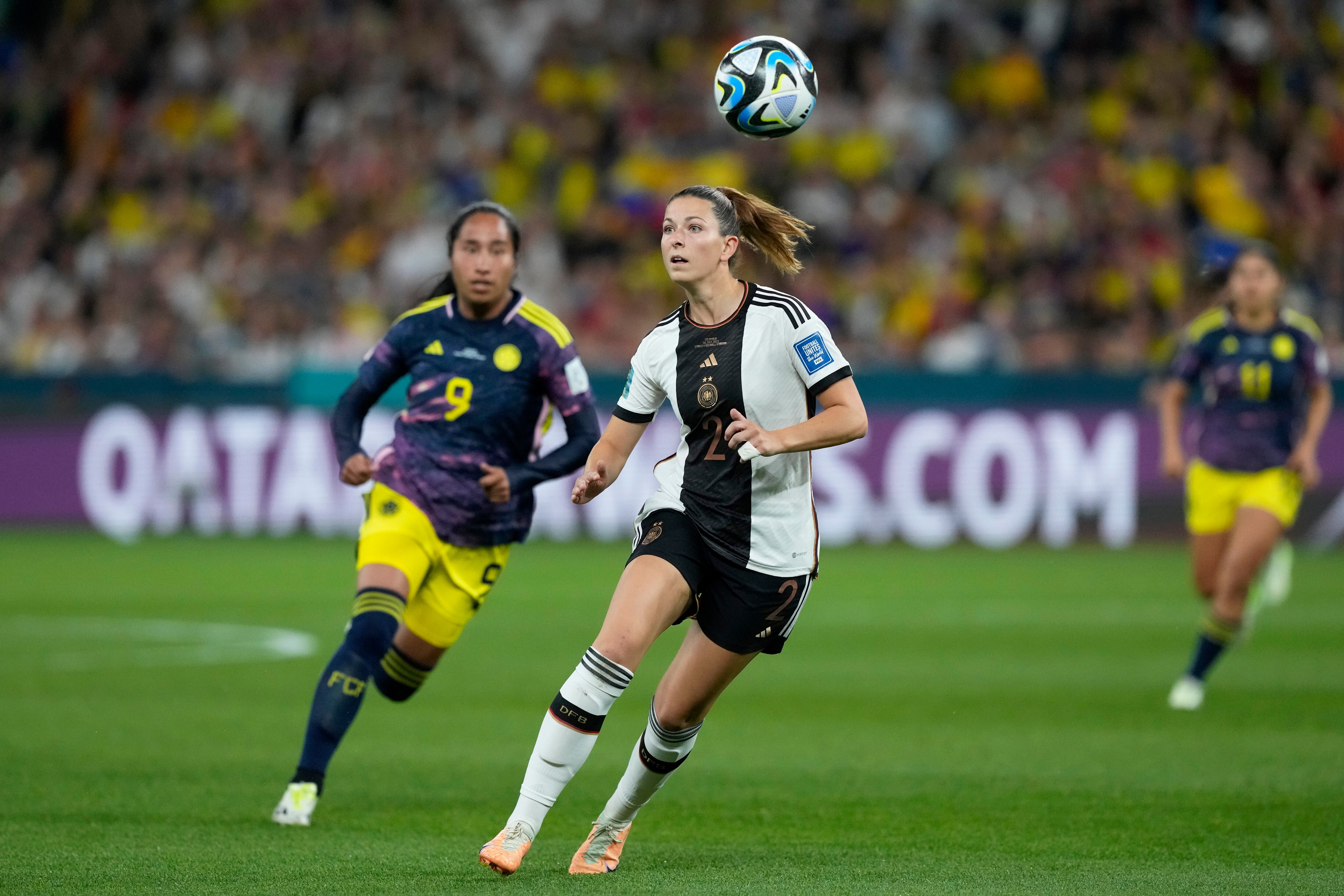 Germany's Chantal Hagel controls the ball in front of Colombia's Mayra Ramirez, left, during the Women's World Cup Group H soccer match between Germany and Colombia at the Sydney Football Stadium in Sydney, Australia, Sunday, July 30, 2023. (AP Photo/Mark Baker)