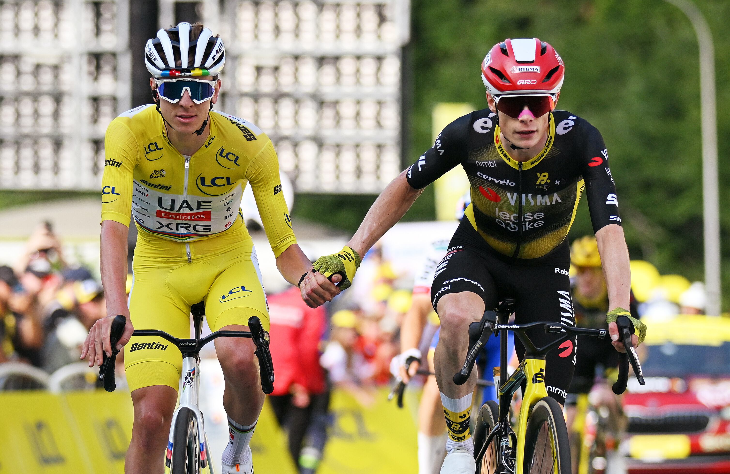 LE MONT-DORE PUY DE SANCY, FRANCE - JULY 14: (EDITOR'S NOTE: Alternate crop) (L-R) Tadej Pogacar of Slovenia and UAE Team Emirates - XRG - Yellow leader jersey and Jonas Vingegaard of Denmark and Team Visma | Lease a Bike cross the finish line during the 112th Tour de France 2025, Stage 10 a 165.3km stage from Ennezat to Le Mont-Dore Puy de Sancy (Super Sancy) 1318m / #UCIWT / on July 14, 2025 in Le Mont-Dore Puy de Sancy, France. (Photo by Dario Belingheri/Getty Images)
