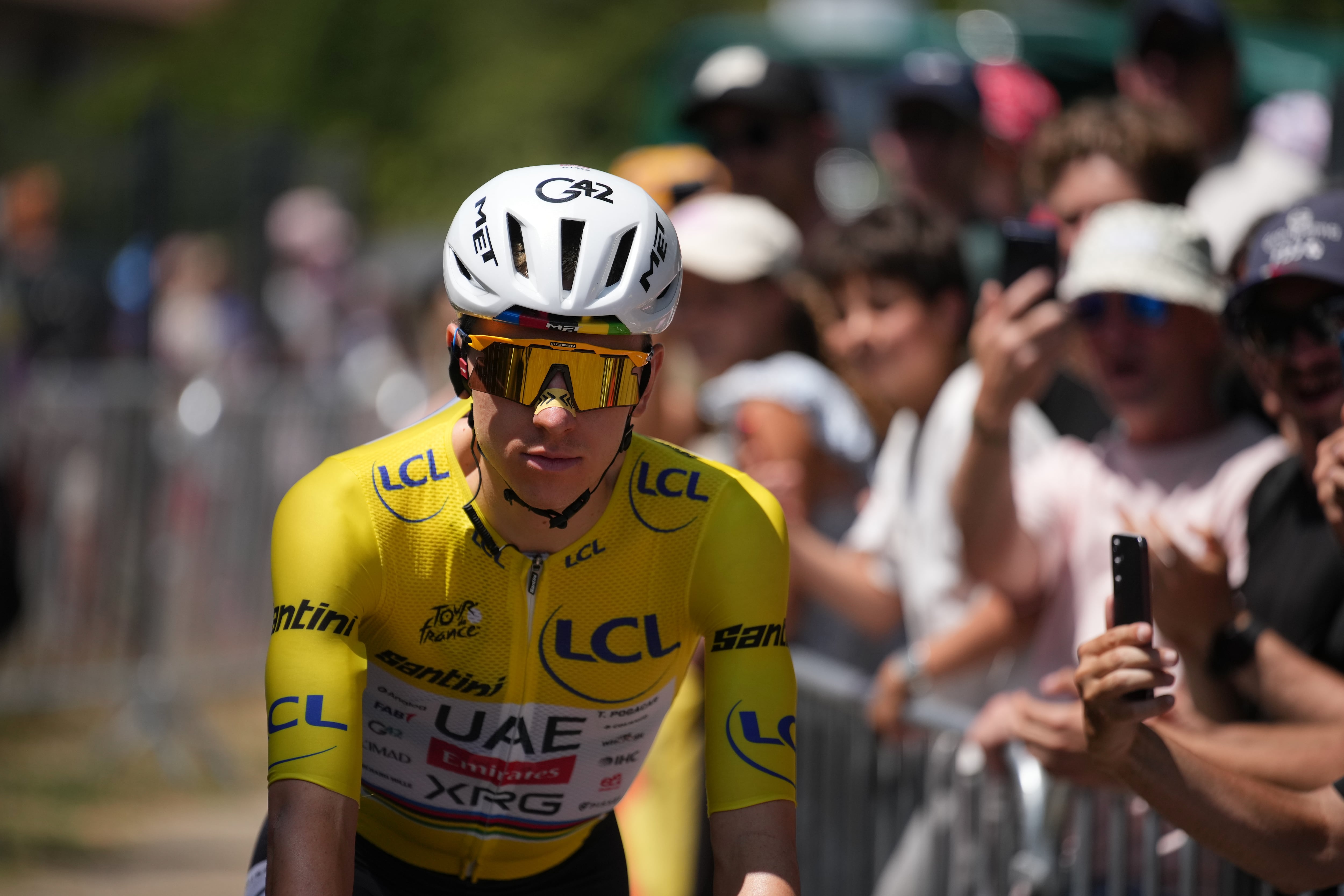 Slovenia's Tadej Pogacar, wearing the overall leader's yellow jersey, arrives at the start of the nineteenth stage of the Tour de France cycling race with start in Gap and finish in Alpe d'Huez, France, Friday, July 24, 2026. (AP Photo/Mosa'ab Elshamy)