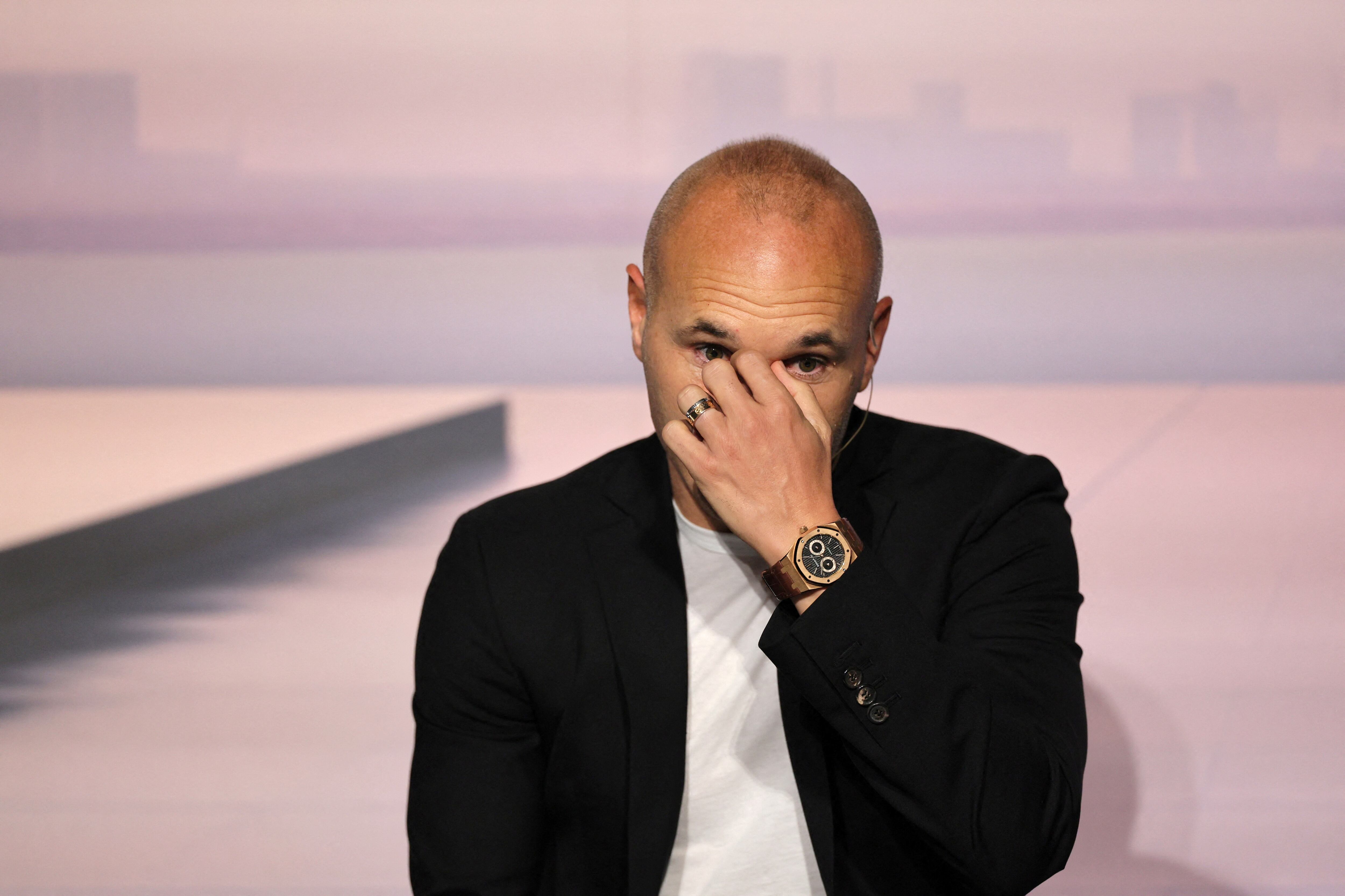 Spanish footballer Andres Iniesta reacts during an event to celebrate his career at the America's Cup Experience venue in Barcelona on October 8, 2024. Andres Iniesta scored the most important goal in the history of Spanish football, winning his country the World Cup for the first time in 2010. Iniesta came through Barcelona's La Masia youth academy, joining the club aged 12, departing 22 years later to join Japanese club Vissel Kobe before spending last season at Emirates in the United Arab Emirates. (Photo by LLUIS GENE / AFP)