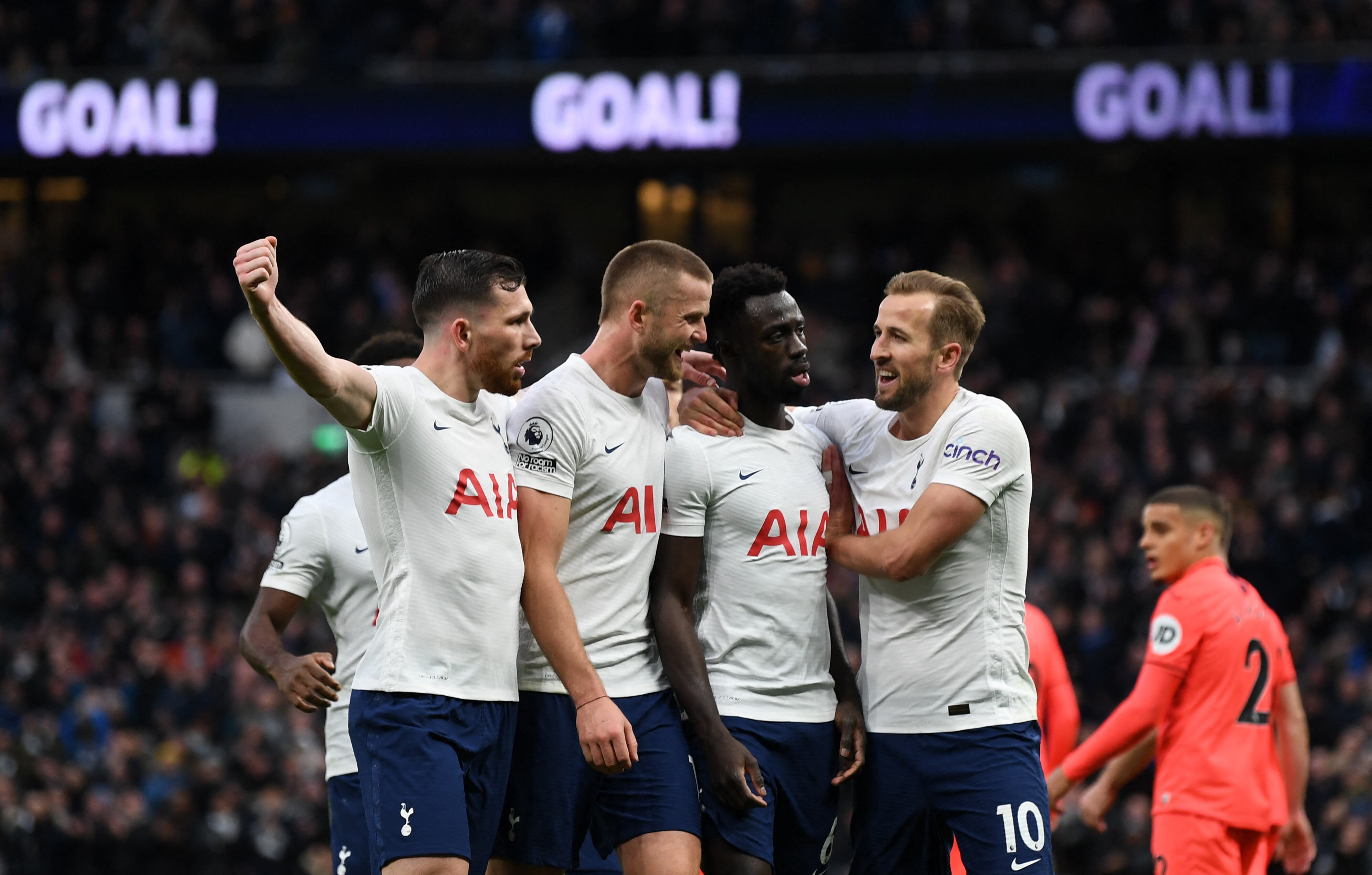 Tottenham Hotspur's Colombian defender Davinson Sanchez (3rd R) celebrates with teammates after scoring their second goal during the English Premier League football match between Tottenham Hotspur and Norwich City at Tottenham Hotspur Stadium in London, on December 5, 2021. (Photo by Daniel LEAL / AFP) / RESTRICTED TO EDITORIAL USE. No use with unauthorized audio, video, data, fixture lists, club/league logos or 'live' services. Online in-match use limited to 120 images. An additional 40 images may be used in extra time. No video emulation. Social media in-match use limited to 120 images. An additional 40 images may be used in extra time. No use in betting publications, games or single club/league/player publications. /