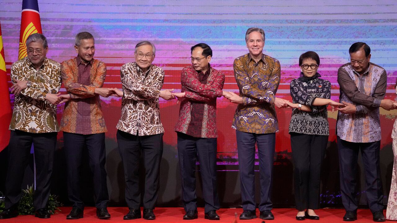 From left to right, Philippine's Foreign Secretary Enrique Manalo, Singaporean Foreign Minister Vivian Balakrishnan, Thailand's Foreign Minister Don Pramudwinai, Vietnam's Foreign Minister Bui Thanh Son, U.S. Secretary of State Antony Blinken, Indonesian Foreign Minister Retno Marsudi and Cambodia's Foreign Minister Prak Sokhonn hold hands as they pose for a group photo during the ASEAN Post Ministerial Conference with the United States at the Association of Southeast Asian Nations (ASEAN) Foreign Ministers' Meeting in Jakarta, Indonesia, Friday, July 14, 2023. (AP Photo/Dita Alangkara, Pool)