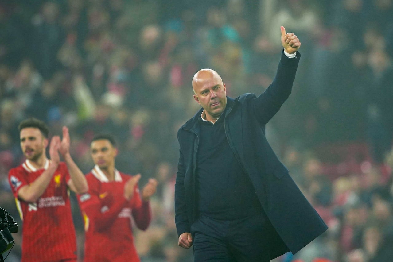 Liverpool's coach Arne Slot celebrates his team 3-1 victory over Leicester City at the end of a English Premier League soccer match at the Anfield stadium in Liverpool, Thursday, Dec. 26, 2024. (AP Photo/Ian Hodgson)
