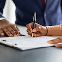 Contract Signing. Female Customer Sign Papers In Dealership Office, Unrecognizable African American Woman Client Buying New Car Or Purchasing Property, Closeup Shot, Cropped Image With Free Space