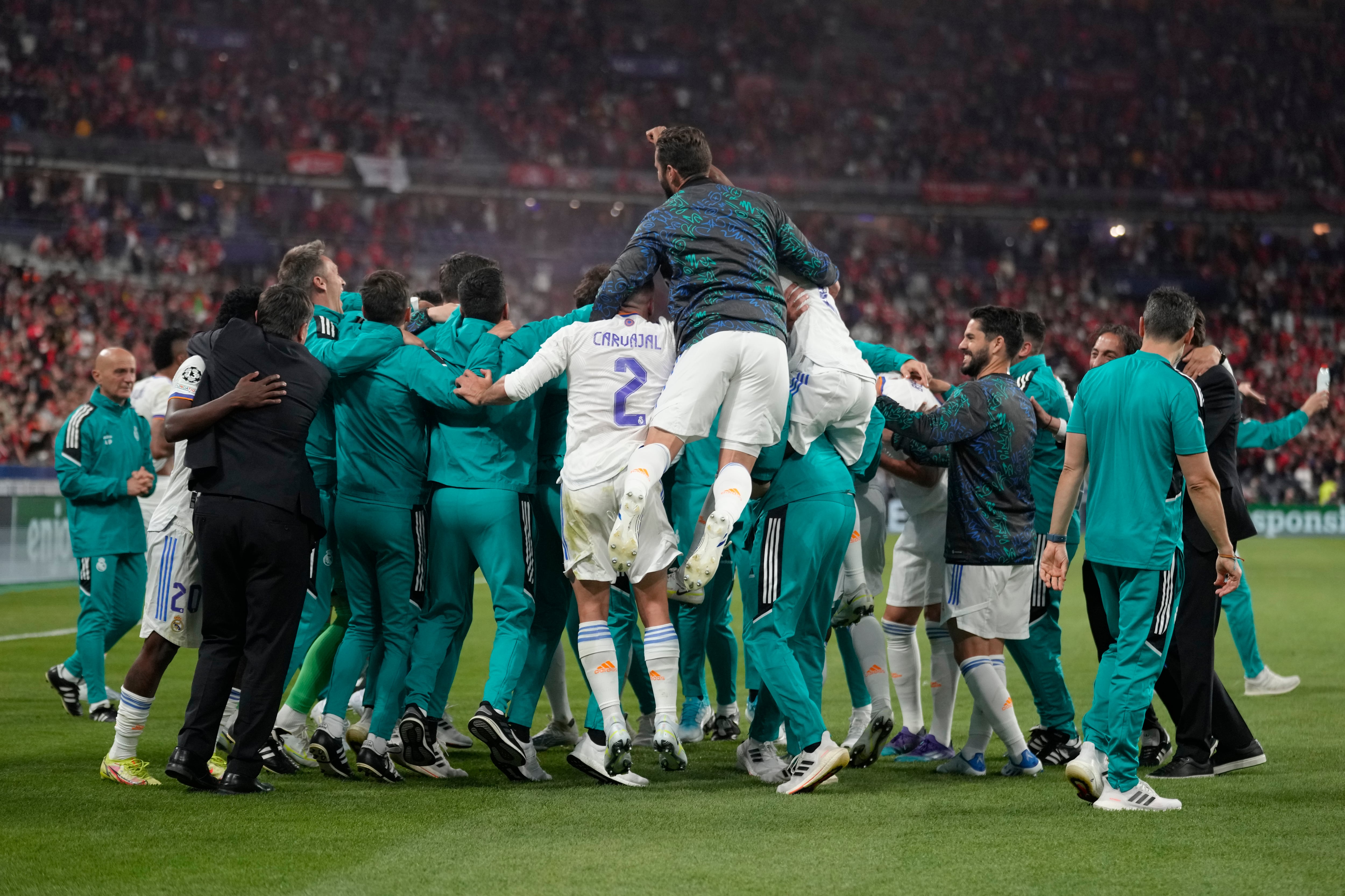 Real Madrid celebrate winning the Champions League final soccer match between Liverpool and Real Madrid at the Stade de France in Saint Denis near Paris, Saturday, May 28, 2022. Real Madrid won 1-0. (AP Photo/Kirsty Wigglesworth)