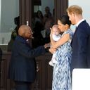 FILE - In this Sept. 25, 2019, file photo, Britain's Prince Harry and Meghan, Duchess of Sussex, holding their son Archie, meet Anglican Archbishop Emeritus, Desmond Tutu and his wife Leah in Cape Town, South Africa. Almost as soon as Meghan and Prince Harry's interview with Oprah Winfrey aired, many were quick to deny Meghan’s allegations of racism on social media. Many say it was painful to watch Meghan’s experiences with racism invalidated by the royal family, members of the media and the public, offering up yet another example of a Black woman’s experience being disregarded and denied. (Henk Kruger/Pool via AP, File)