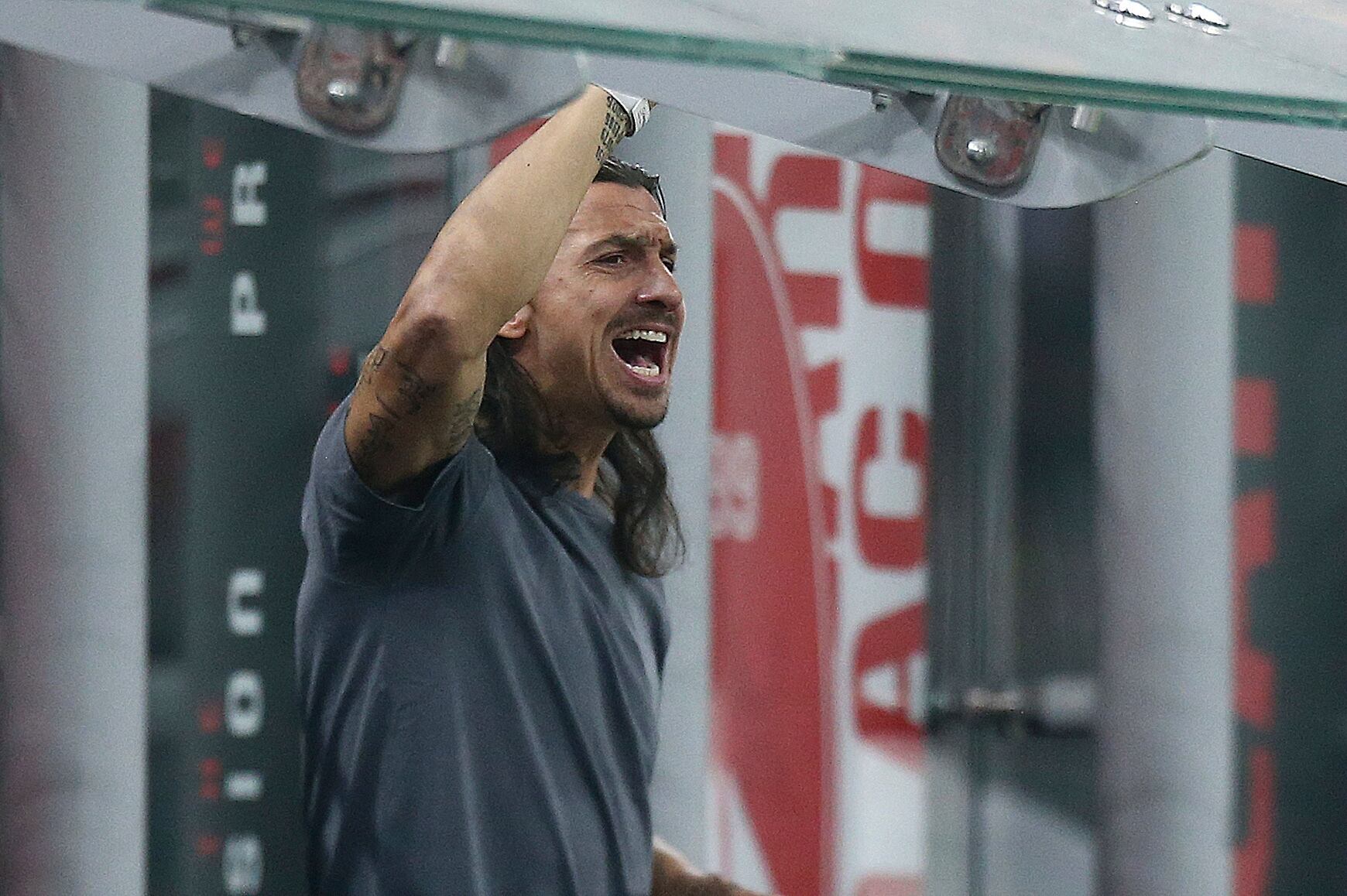 FILE - AC Milan's Zlatan Ibrahimovic reacts as he stands near the bench during a Serie A soccer match between AC Milan and Monza, at the San Siro stadium in Milan, Italy, Saturday, Oct. 22, 2022.  A beleaguered AC Milan could be set to call on its talismanic Swede yet again. Zlatan Ibrahimovic officially retired at the end of last season with an emotional speech at San Siro that left many in tears. But during a difficult October Milan has reportedly been in constant contact with the 42-year-old about a potential third spell at the club in an off-the-field capacity. (Spada/LaPresse via AP, File