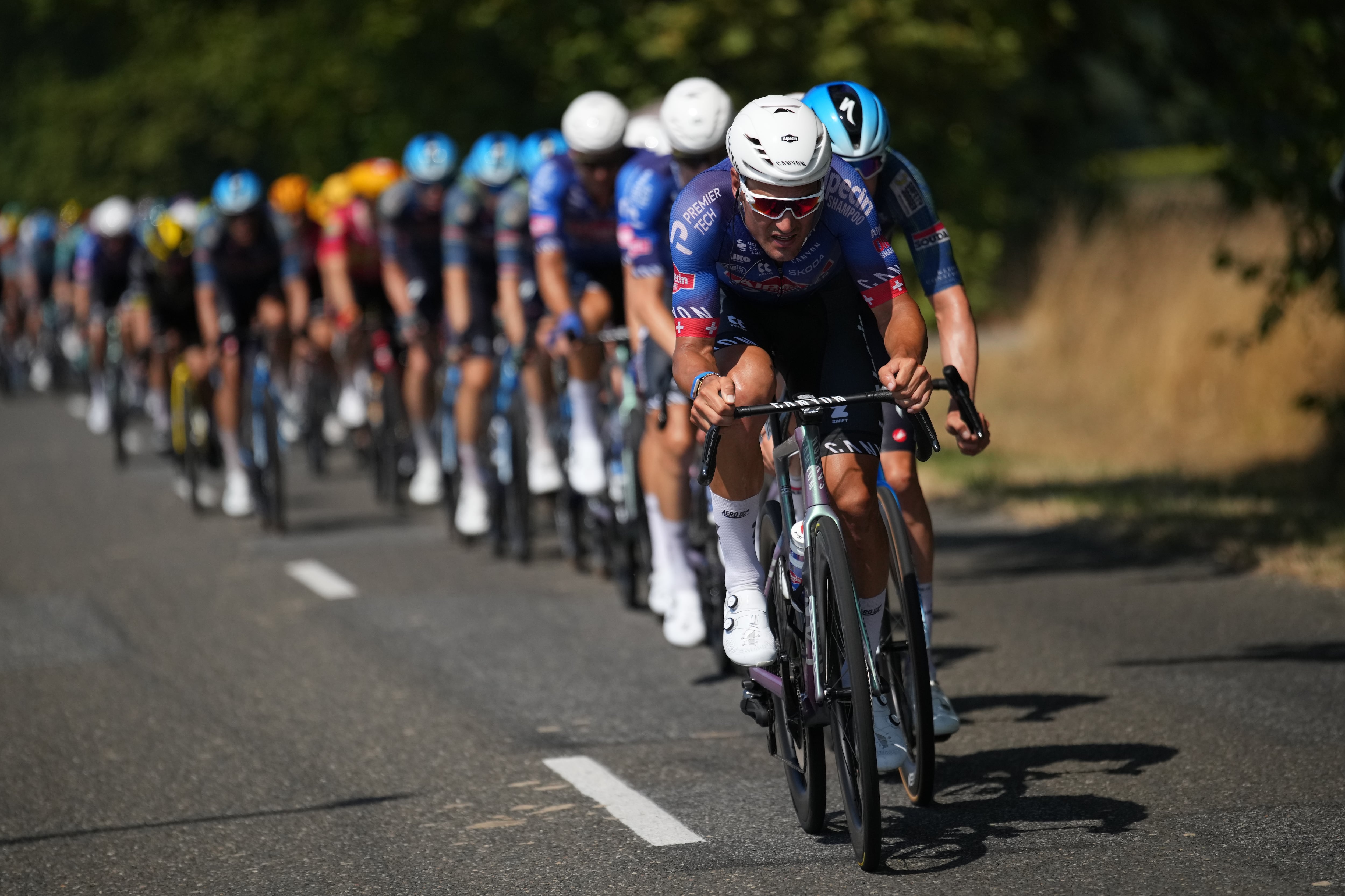 The pack rides during the fifth stage of the Tour de France cycling race over 158.3 kilometers (98.1 miles) with start in Lannemezan and finish in Pau, France, Wednesday, July 8, 2026. (AP Photo/Mosa'ab Elshamy)