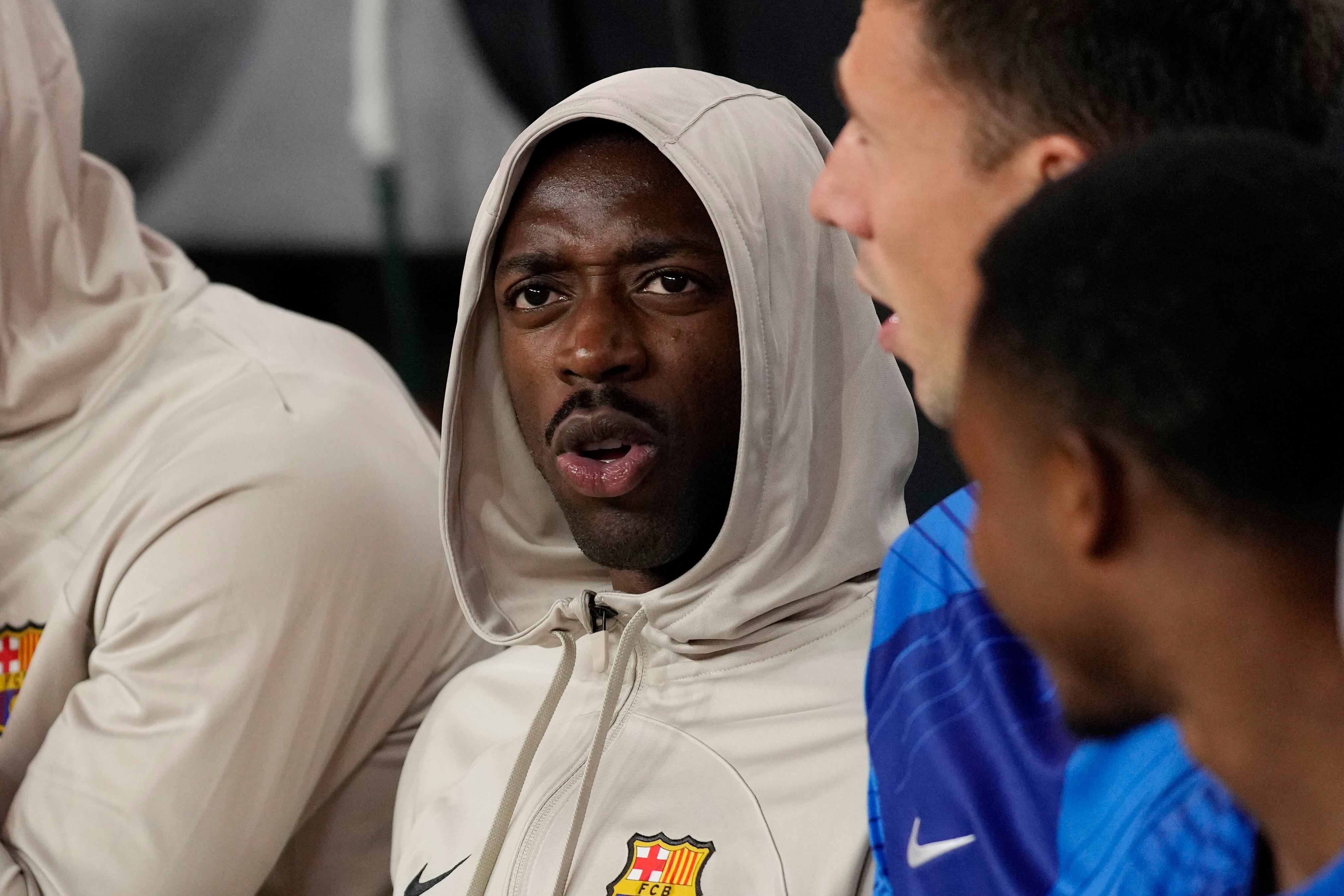 FC Barcelona midfielder Ousmane Dembele watches before a Champions Tour soccer match against AC Milan, Tuesday, Aug. 1, 2023, in Las Vegas. (AP Photo/John Locher)