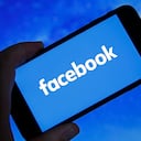 PARIS, FRANCE - OCTOBER 06: In this photo illustration, the Facebook logo is displayed on the screen of an iPhone on October 06, 2021 in Paris, France. Frances Haugen, a former employee of the Facebook social network created by Mark Zuckerberg, told the US Senate on October 05 that Facebook was prioritizing its profits at the expense of security and the impact of the social network on young users. To support her claims, Frances Haugen draws on her two-year experience as a product manager at Facebook and on the thousands of documents she took with her last spring, grouped together under the name of "Facebook Files ". (Photo illustration by Chesnot/Getty Images)