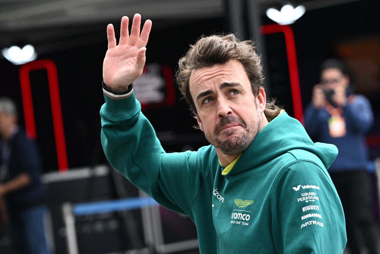 Aston Martin's Spanish driver Fernando Alonso waves after taking part in the third practice session for the Formula One Japanese Grand Prix race at the Suzuka circuit in Suzuka, Mie prefecture on April 6, 2024. (Photo by Philip FONG / AFP)