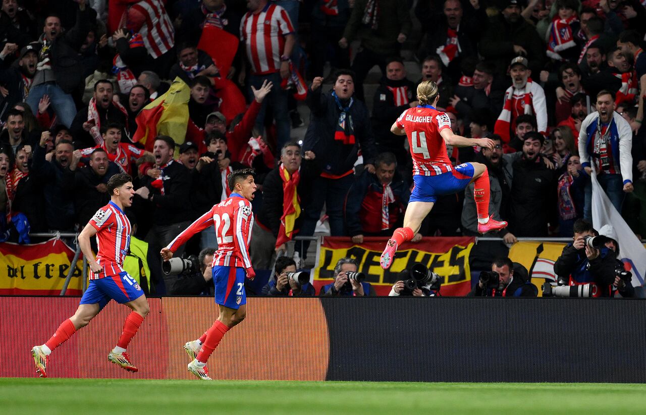 MADRID, SPAIN - MARCH 12: Conor Gallagher of Atletico de Madrid celebrates scoring his team's first goal with teammates during the UEFA Champions League 2024/25 Round of 16 second leg match between Atletico de Madrid and Real Madrid C.F. at Estadio Metropolitano on March 12, 2025 in Madrid, Spain. (Photo by David Ramos - UEFA/UEFA via Getty Images)MADRID, SPAIN - MARCH 12: Conor Gallagher of Atletico de Madrid celebrates scoring his team's first goal with teammates during the UEFA Champions League 2024/25 Round of 16 second leg match between Atletico de Madrid and Real Madrid C.F. at Estadio Metropolitano on March 12, 2025 in Madrid, Spain. (Photo by David Ramos - UEFA/UEFA via Getty Images)