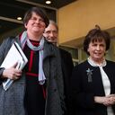 FILE - In this Thursday, April 11, 2019 file photo, Northern Ireland Democratic Unionist Party leader Arlene Foster, center, speaks to journalists after her meeting with European Union chief Brexit negotiator Michel Barnier at EU headquarters in Brussels. Foster, the leader of Northern Ireland announced her resignation on Wednesday, April 28 after party members mounted a push to oust her over her handling of the fallout from Brexit and other issues. Foster said she would step down as leader of the Democratic Unionist Party on May 28 and as First Minister of Northern Ireland at the end of June. (AP Photo/Francisco Seco, File)