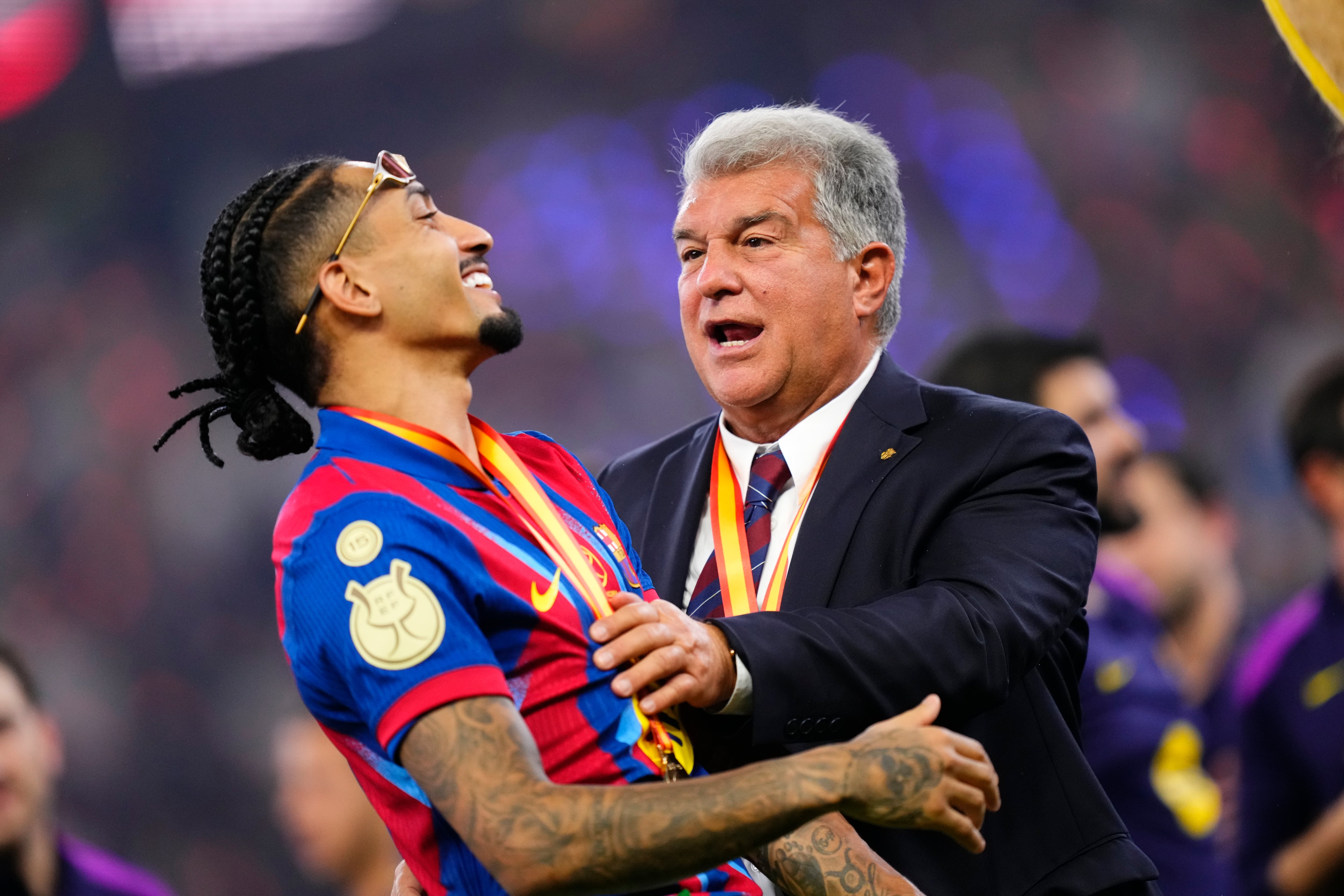 Raphinha and Joan Laporta celebrate the victory after winning the Spanish Super Cup final match between FC Barcelona and Real Madrid at King Abdullah Sports City Hall Stadium on January 11, 2026 in Jeddah, Saudi Arabia.   (Photo by Jose Breton/Pics Action/NurPhoto via Getty Images)