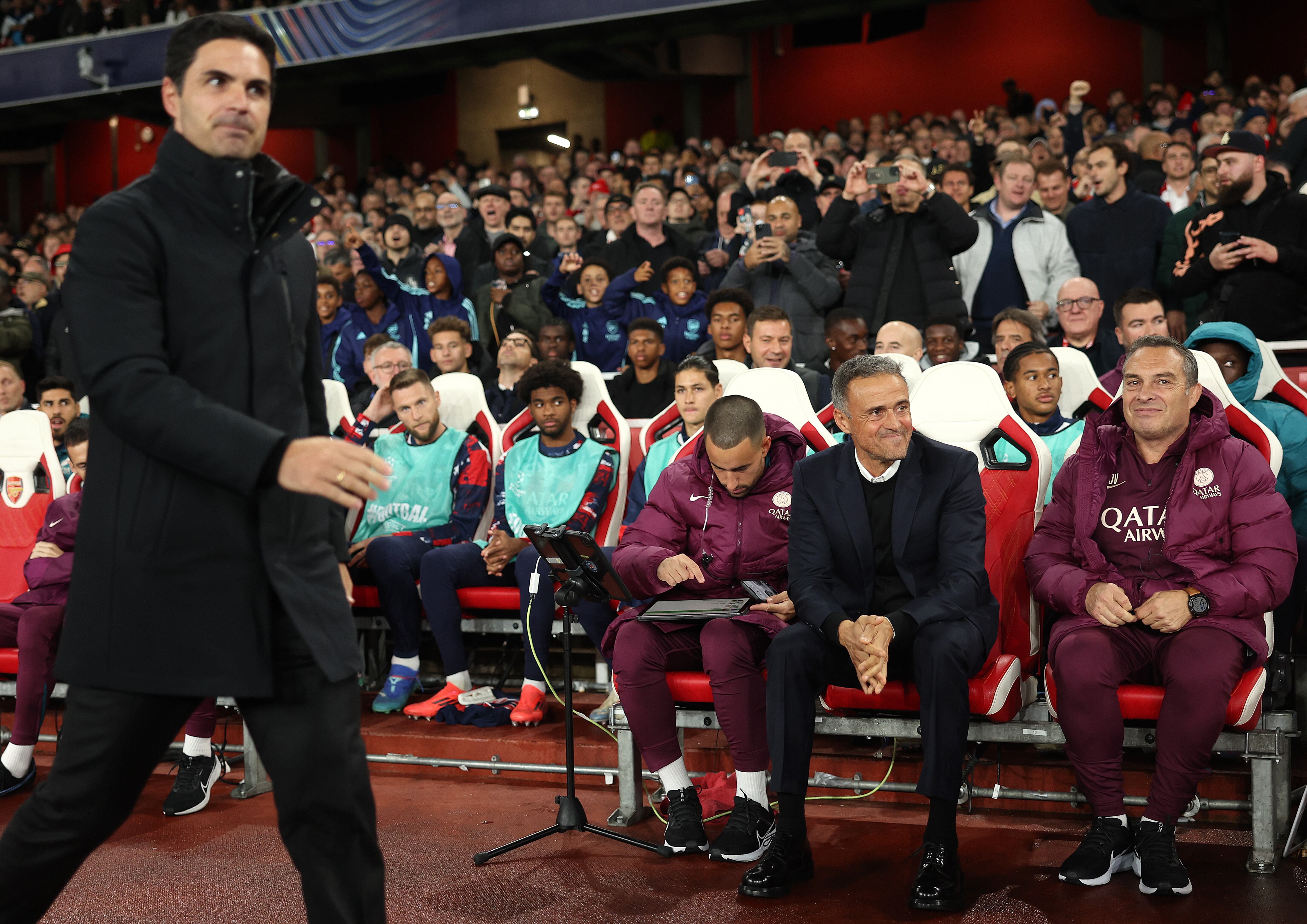 LONDON, ENGLAND - OCTOBER 01: Luis Enrique, Head Coach of Paris Saint-Germain looks on as Mikel Arteta Arsenal manager walks past during the UEFA Champions League 2024/25 League Phase MD2 match between Arsenal FC and Paris Saint-Germain at  on October 01, 2024 in London, England. (Photo by Julian Finney/Getty Images)