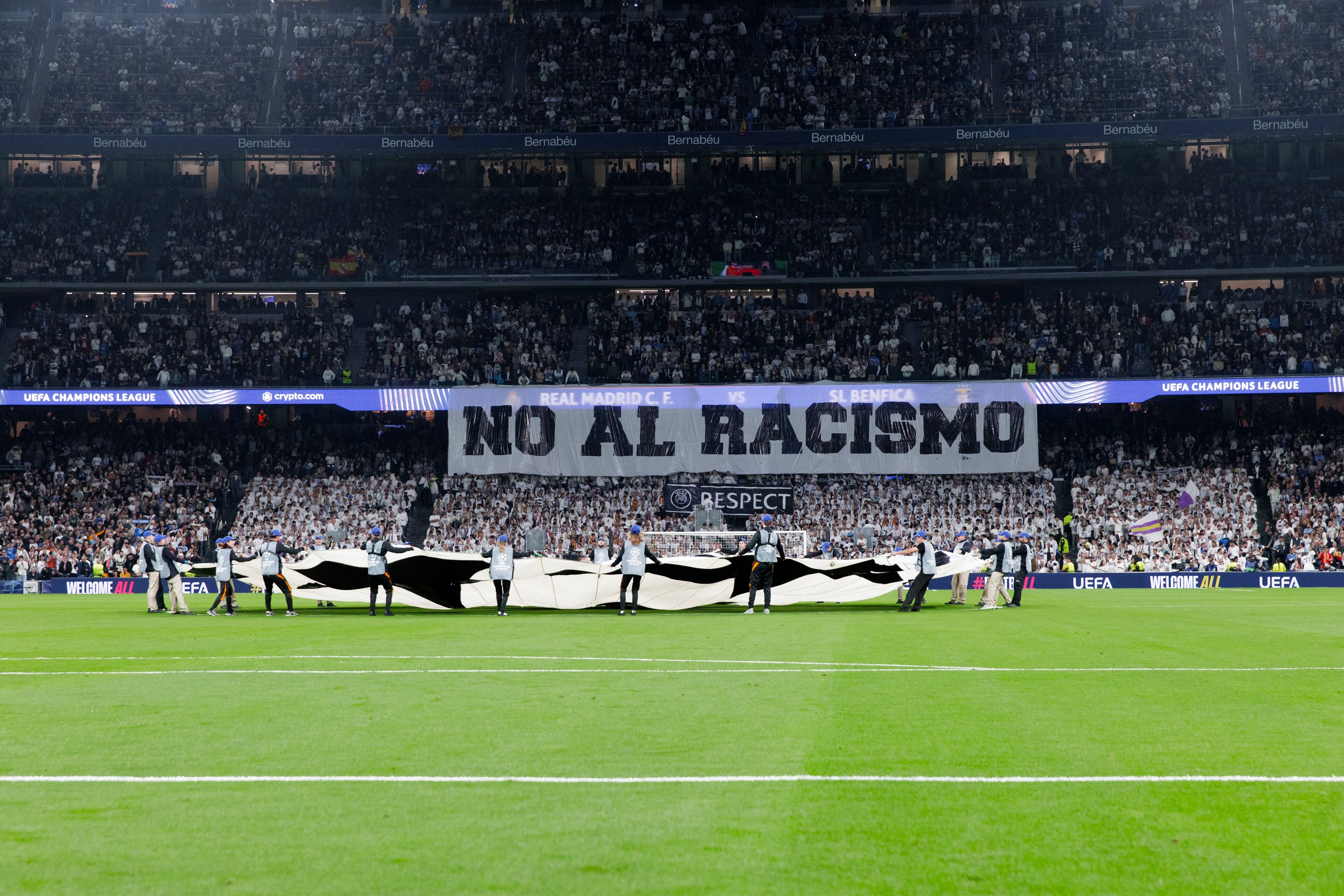 In Madrid, Spain, on February 25, Real Madrid supporters display a giant banner that reads ''no to racism'' during the UEFA Champions League 2025/26 Knockout Play-off second leg match between Real Madrid and Benfica at Santiago Bernabeu Stadium. (Photo by Guille Martinez/f22photo/NurPhoto) (Photo by Guillermo Martinez/NurPhoto) (Photo by Guillermo Martinez / NurPhoto via AFP)