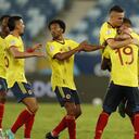 Colombia's Edwin Cardona, right, celebrates with teammates after scoring his side's opening goal against Ecuador during a Copa America soccer match at Arena Pantanal stadium in Cuiaba, Brazil, Sunday, June 13, 2021. (AP Photo/Bruna Prado)