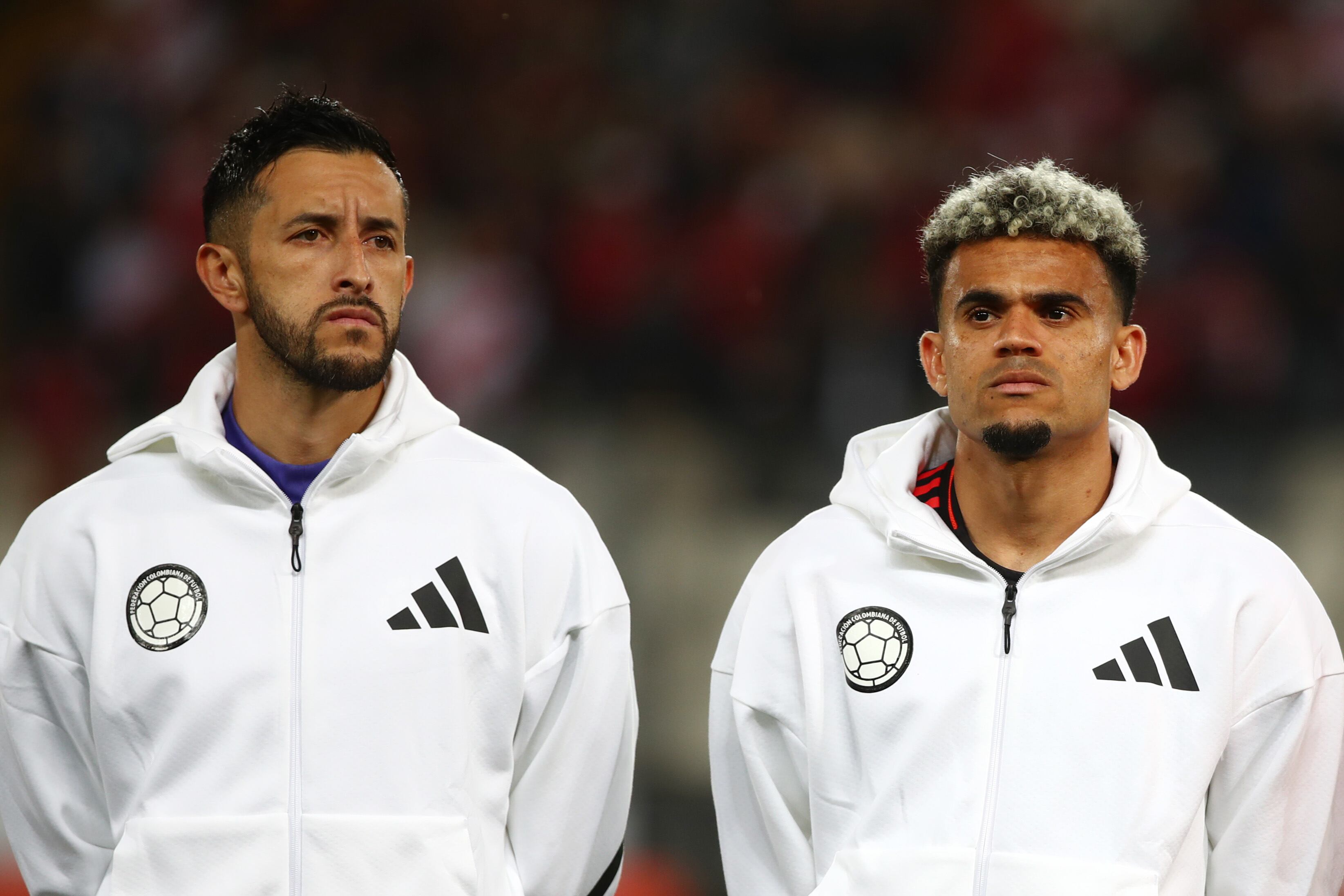 LIMA, PERU - SEPTEMBER 06: (L-R) Camilo Vargas and Luis Diaz of Colombia line up for the national anthem prior to the South American FIFA World Cup 2026 Qualifier match between Peru and Colombia at Estadio Monumental on September 06, 2024 in Lima, Peru.  (Photo by Raul Sifuentes/Getty Images)
