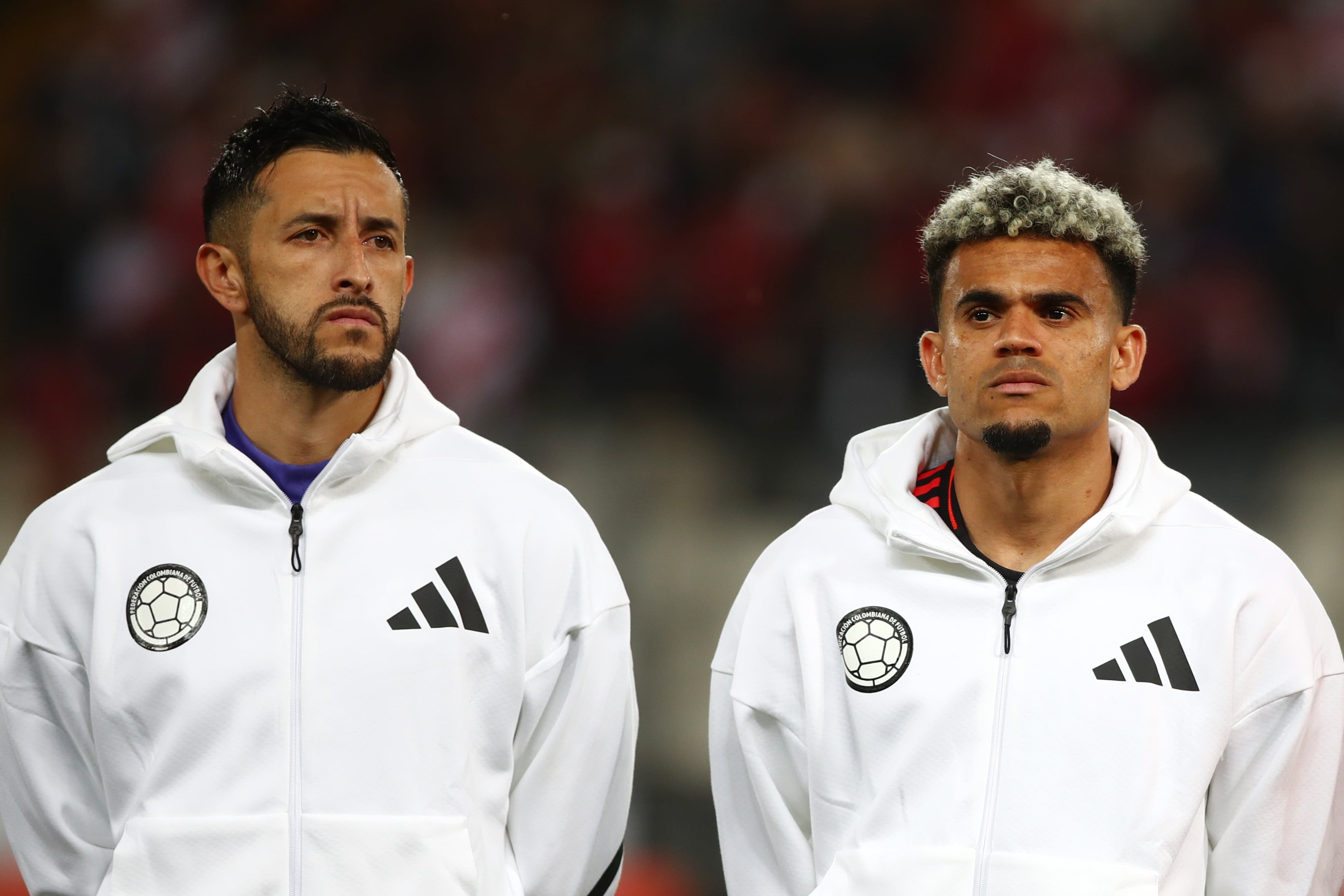 LIMA, PERU - SEPTEMBER 06: (L-R) Camilo Vargas and Luis Diaz of Colombia line up for the national anthem prior to the South American FIFA World Cup 2026 Qualifier match between Peru and Colombia at Estadio Monumental on September 06, 2024 in Lima, Peru.  (Photo by Raul Sifuentes/Getty Images)