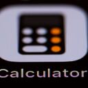 17 September 2019, Hessen, Rüsselsheim: Illustration - The Apple calculator icon can be seen on a smartphone display. Photo: Silas Stein/dpa (Photo by Silas Stein/picture alliance via Getty Images)