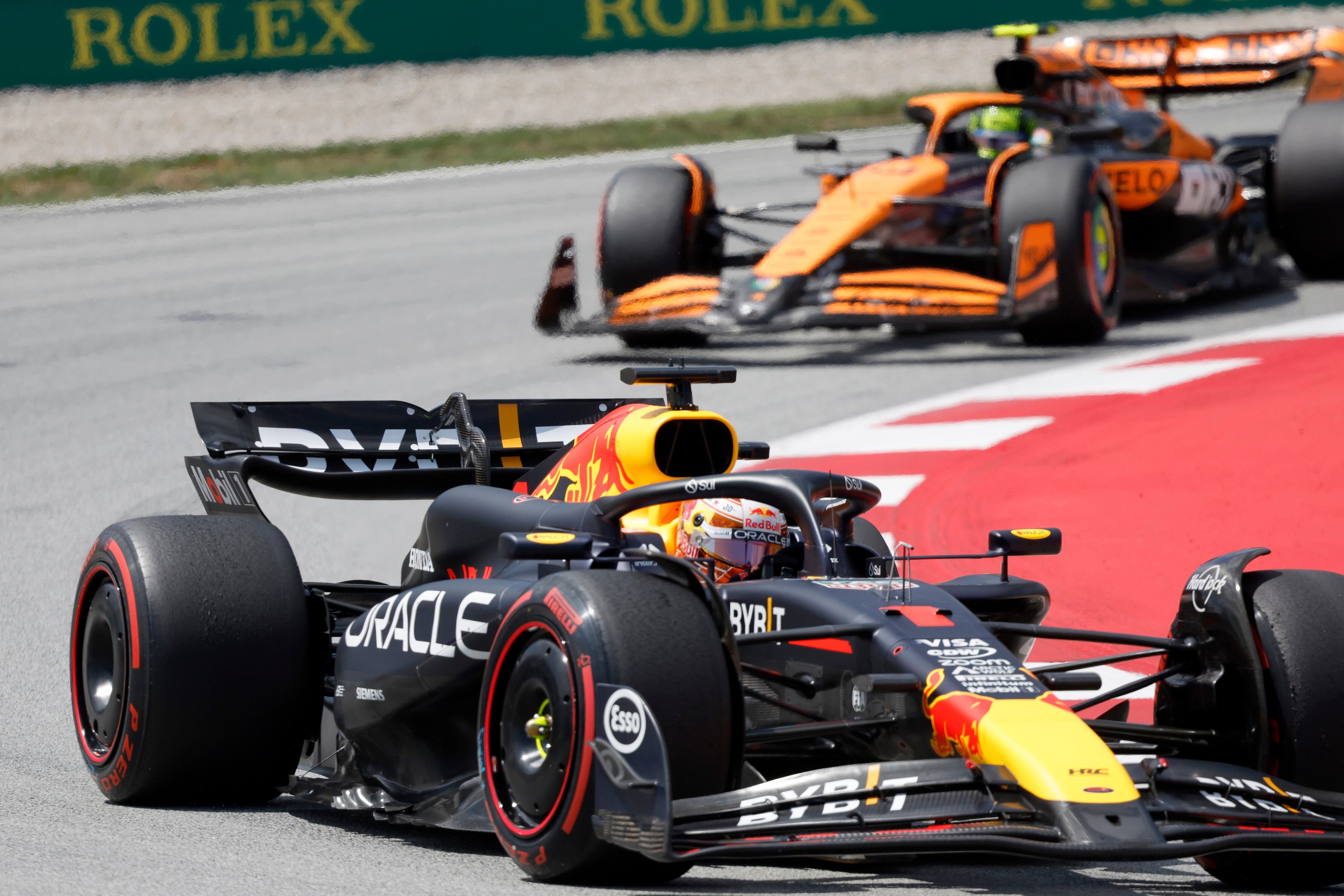 Red Bull driver Max Verstappen of the Netherlands steers his car followed by McLaren driver Lando Norris of Britain during the Formula 1 Spanish Grand Prix race at the Barcelona Catalunya racetrack in Montmelo, near Barcelona, Spain, Sunday, June 23, 2024. (AP Photo/Joan Monfort)