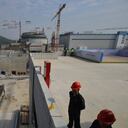 (FILES) This file photo taken on December 8, 2013 shows workers waiting for then-French Prime Minister Jean-Marc Ayrault to arrive at the joint Sino-French Taishan Nuclear Power Station outside the city of Taishan in Guangdong province. - French nuclear firm Framatome said on June 14, 2021 it was working to resolve a "performance issue" at the plant it part-owns in China's southern Guangdong province following a US media report of a potential leak there. (Photo by PETER PARKS / AFP)