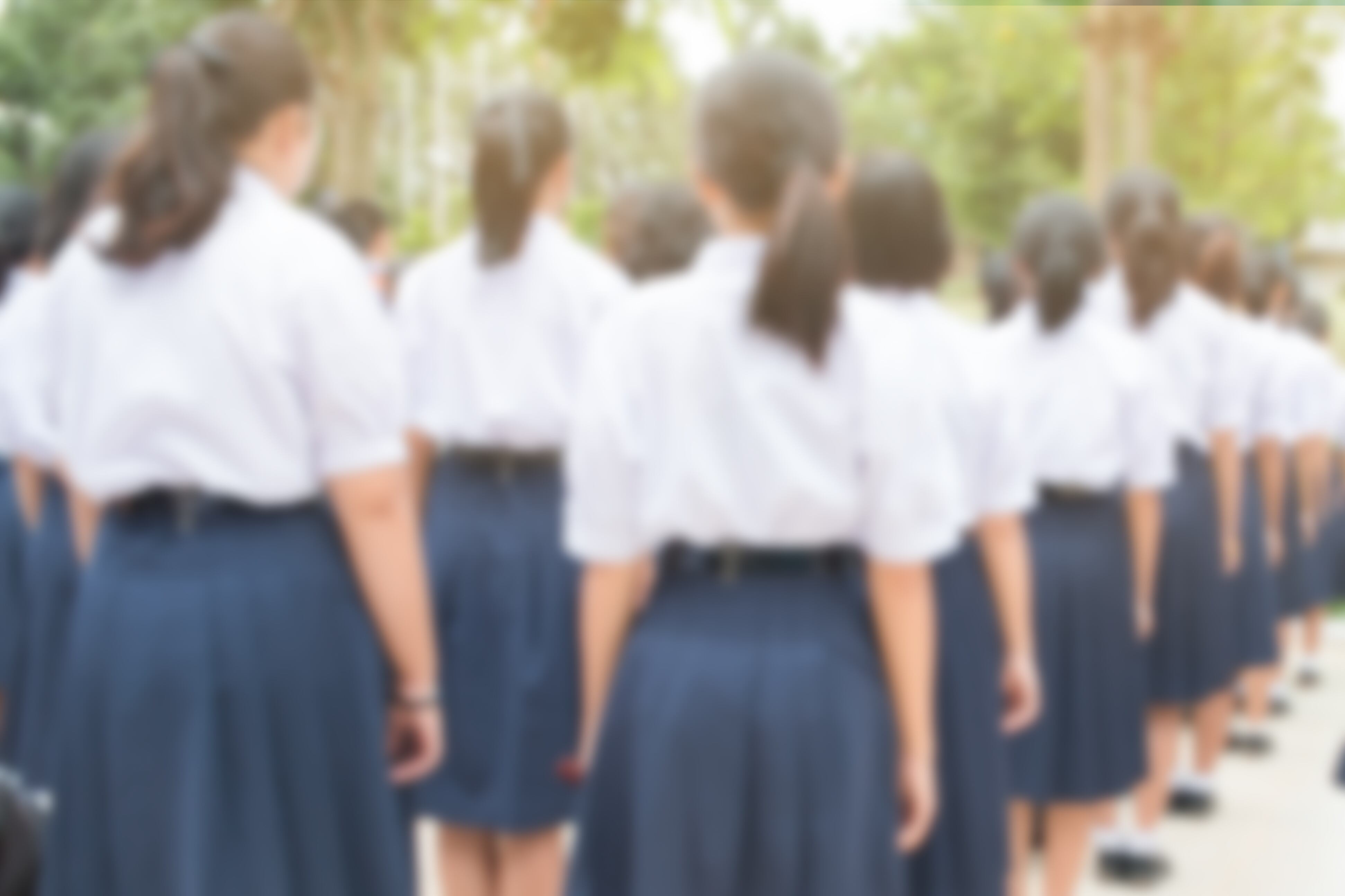 blurred of  group of students in Thailand wear school uniforms standing in line for school activities in morning, Education Concept methods contemporary educational comprises formal systems in Asia.