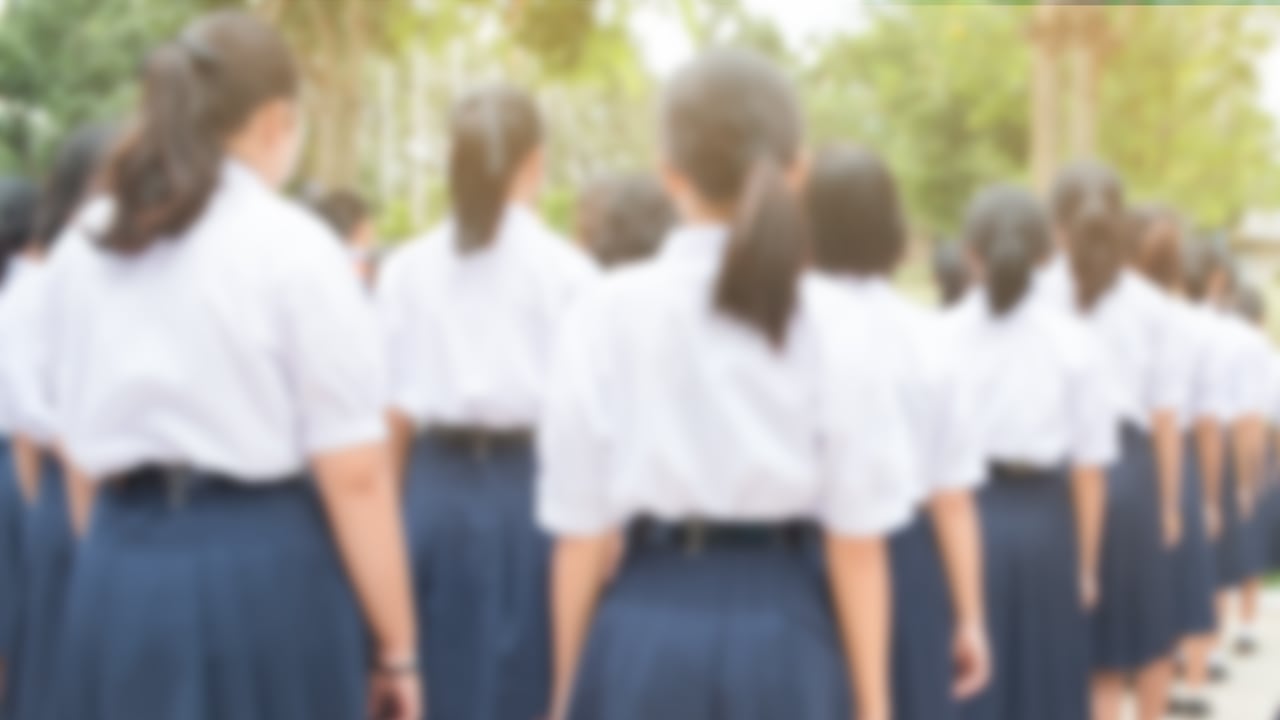 blurred of group of students in Thailand wear school uniforms standing in line for school activities in morning, Education Concept methods contemporary educational comprises formal systems in Asia.