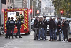 Security and emergency personnel are on October 31, 2020 in Lyon at the scene where an attacker armed with a sawn-off shotgun wounded an Orthodox priest in a shooting before fleeing, said a police source. - The priest, who has Greek nationality, was closing his church when the attack happened and is now in a serious condition, said the source, who asked not to be named. The shooting comes three days after three people were killed in a knife rampage inside a church in the southern town of Nice as France was already on edge after the republication in early September of cartoons of the prophet Mohammed by the Charlie Hebdo weekly, and the beheading of a teacher. (Photo by PHILIPPE DESMAZES / AFP)
