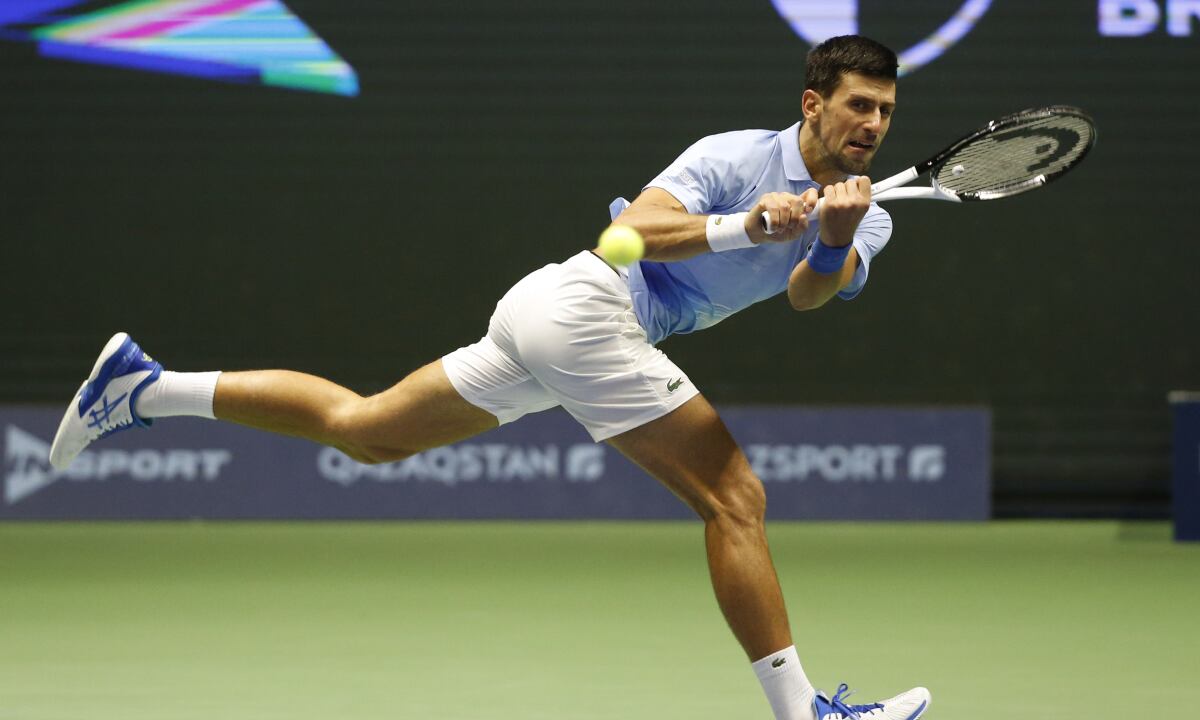 Serbia's Novak Djokovic returns the ball to Stefanos Tsitsipas of Greece during their ATP 500 Astana Open tennis tournament final match in Astana, Kazakhstan, Sunday, Oct. 9, 2022. (AP/Stas Filippov)