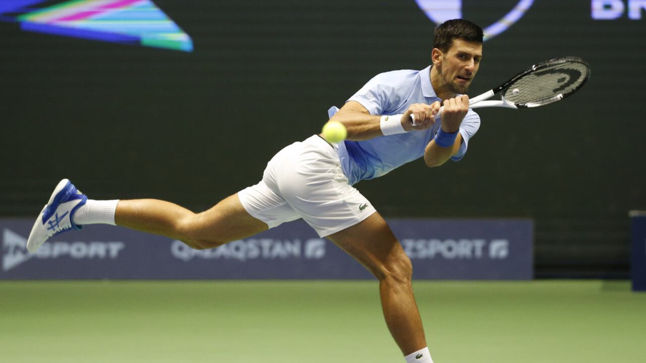 Serbia's Novak Djokovic returns the ball to Stefanos Tsitsipas of Greece during their ATP 500 Astana Open tennis tournament final match in Astana, Kazakhstan, Sunday, Oct. 9, 2022. (AP/Stas Filippov)