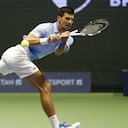 Serbia's Novak Djokovic returns the ball to Stefanos Tsitsipas of Greece during their ATP 500 Astana Open tennis tournament final match in Astana, Kazakhstan, Sunday, Oct. 9, 2022. (AP Photo/Stas Filippov)
