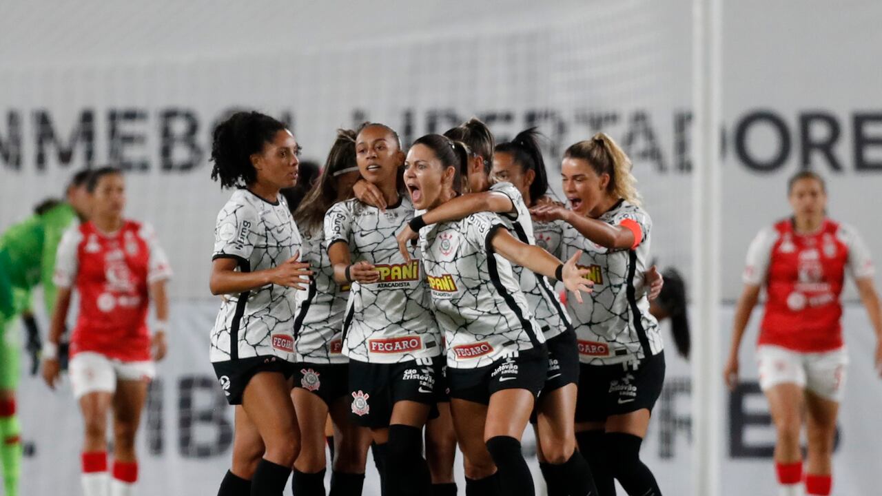 Adriana of Brazil's Corinthians, center, celebrates with teammates after scoring her side's opening goal against Colombia's Independiente Santa Fe during a Copa Libertadores Women's soccer final match at Gran Parque Central stadium, in Montevideo, Uruguay, Sunday, Nov.21, 2021. (AP Photo/Matilde Campodonico)