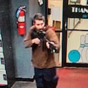 In this image from video released by the Androscoggin County Sheriff's Office, a gunman enters Just-In-Time Recreation in Lewiston, Maine, on Wednesday, Oct. 25, 2023. Maine State Police ordered residents in the state's second-largest city to shelter in place as the suspect remains at large as of Thursday evening. (Androscoggin County Sheriff's Office via AP)