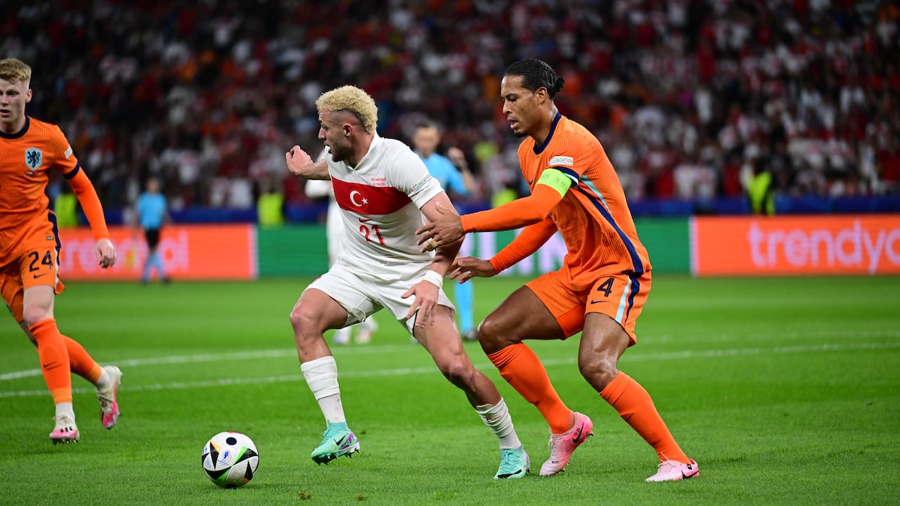 BERLIN, GERMANY - JULY 06: Baris Alper Yilmaz (21) of Turkiye is in action against Virgil van Dijk (4) of Netherlands during the UEFA EURO 2024 Quarter-Final football match between Netherlands and Turkiye at Olympiastadion in Berlin, Germany on July 06, 2024. (Photo by Oguz Yeter/Anadolu via Getty Images)