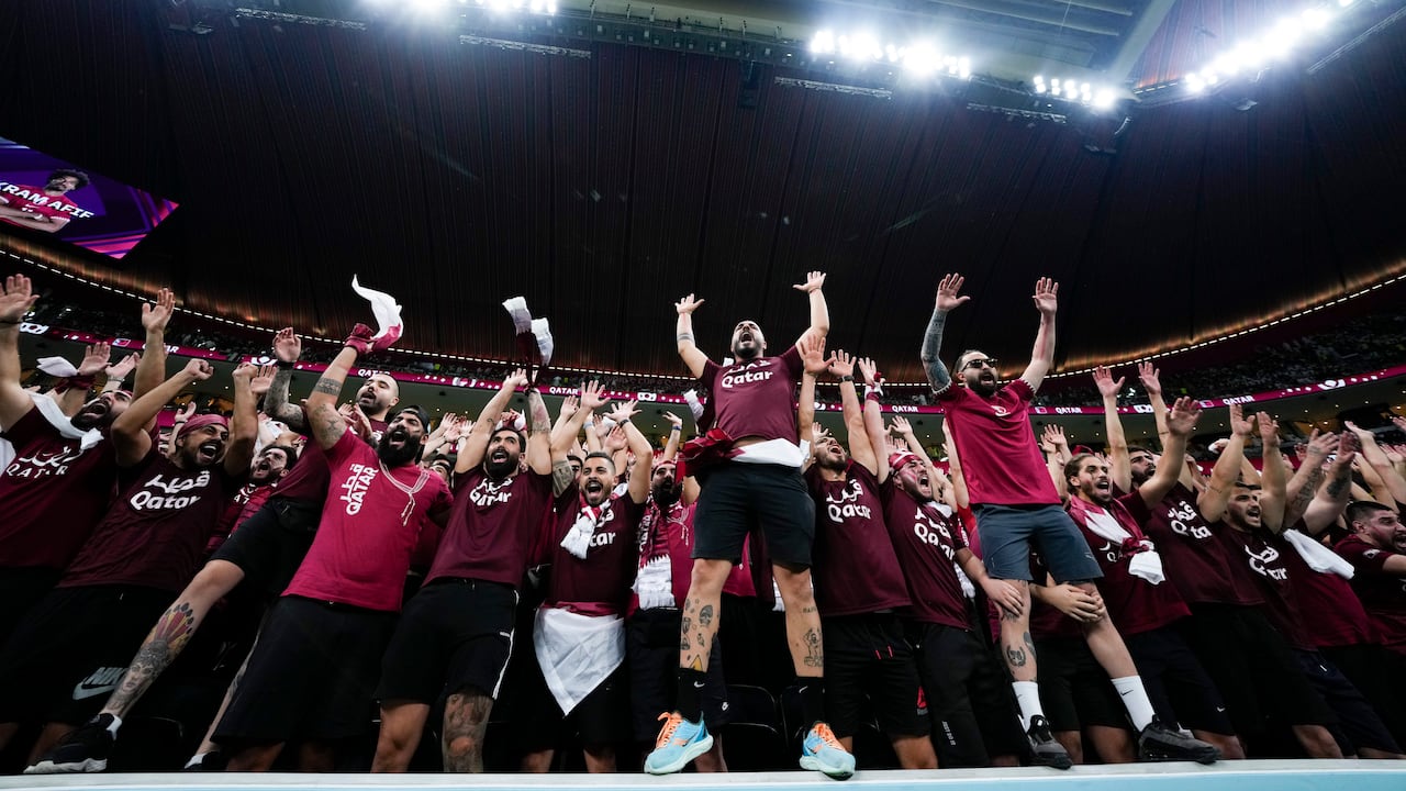 Fans cheer prior to the World Cup opening match between Qatar and Ecuador at the Al Bayt Stadium in Al Khor , Qatar, Sunday, Nov. 20, 2022. (AP Photo/Manu Fernandez)