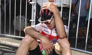 Benjamin Thomas of France, who broke away and got caught by the pack in the last kilometer of the race, reacts after crossing the finish line of the fifteenth stage of the Tour de France cycling race over 202.5 kilometers (125.5 miles) with start in Rodez and finish in Carcassonne, France, Sunday, July 17, 2022. (Tim De Waele/Pool Photo via AP)