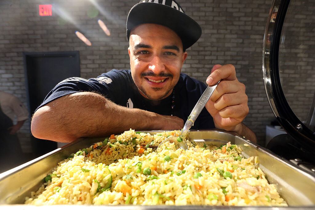 TORONTO, ON - MAY 11: Toronto chef Steven Gonzales of Valdez (Latino street food) and his arroz con pollo at the Terroir Symposium event being held at the Arcadian Court in Toronto. (Vince Talotta/Toronto Star via Getty Images)