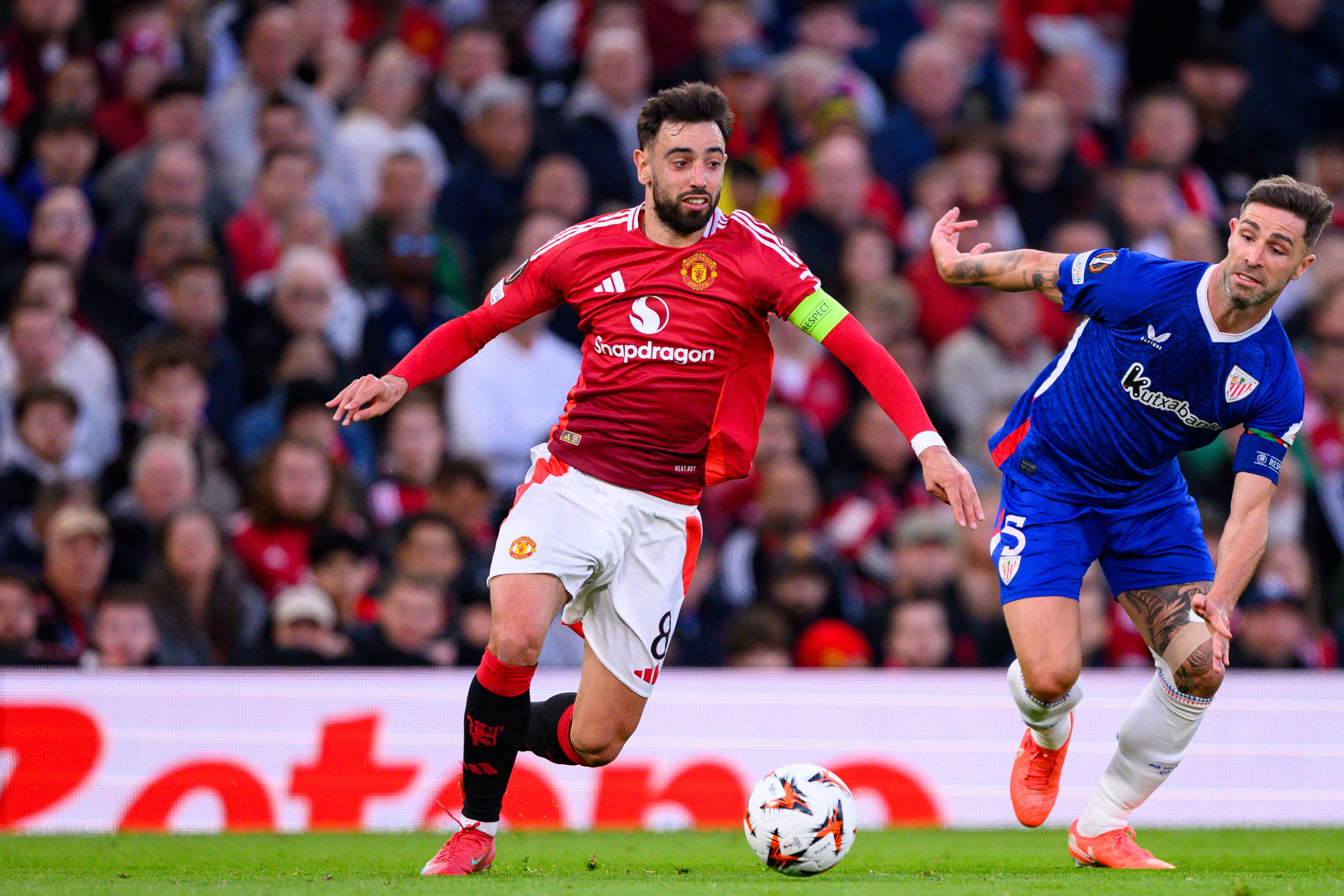 MANCHESTER, ENGLAND - MAY 8: Bruno Fernandes of Manchester United (L) is chased by Yeray Álvarez of Athletic Club (R) during the UEFA Europa League 2024/25 Semi Final Second Leg match between Manchester United and Athletic Club at Old Trafford on May 8, 2025 in Manchester, United Kingdom. (Photo by Richard Callis/Sports Press Photo/Getty Images)