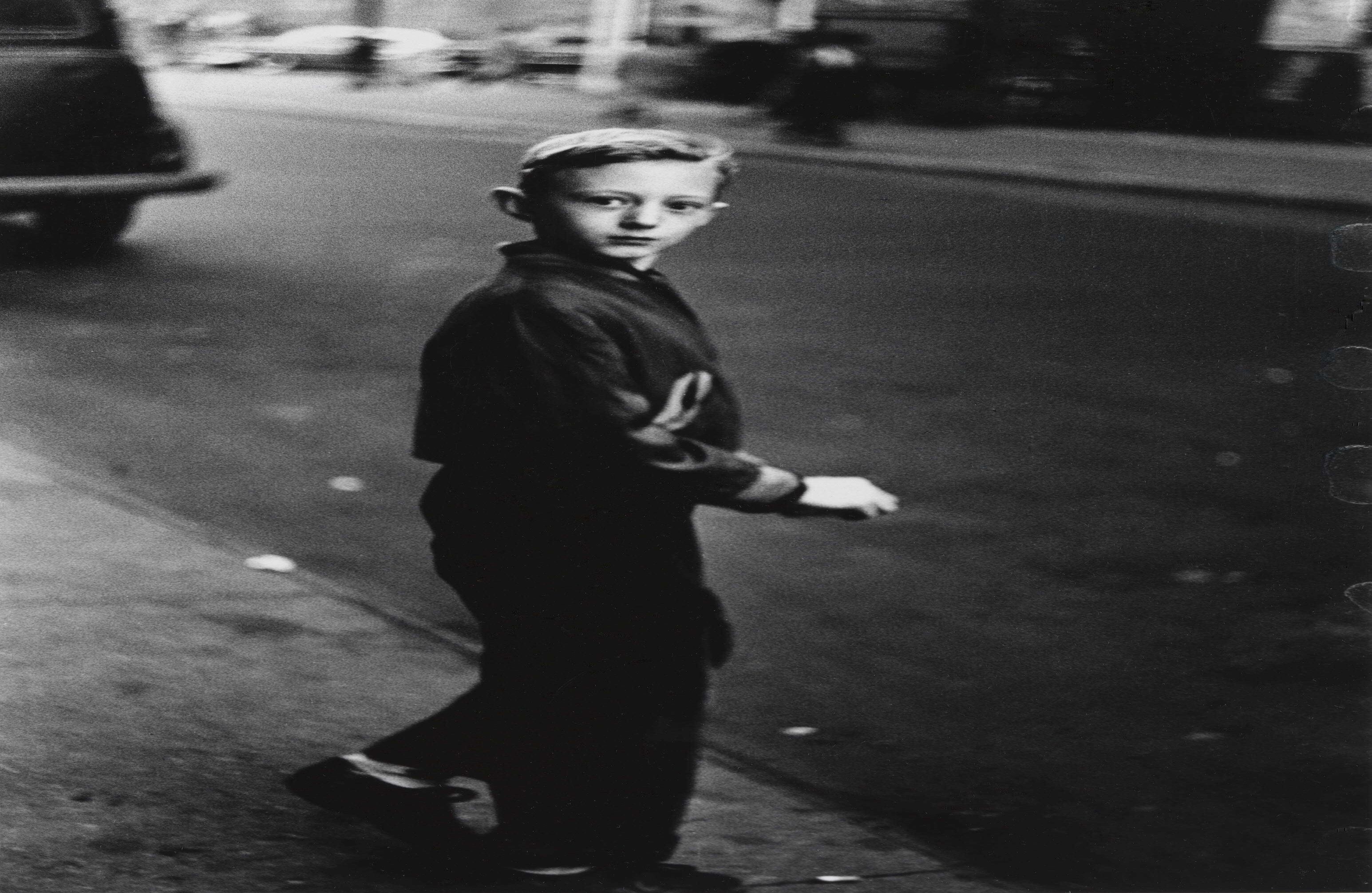 Boy stepping off the curb, N.Y.C. 1957–58.  © The Estate of Diane Arbus, LLC. All Rights Reserved.