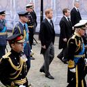 King Charles III, Princess Anne, Prince Andrew, Prince Edward, Prince William, Prince Harry, Peter Phillips, Earl of Snowdon, Duke of Gloucester and Tim Laurence follow The Queen's funeral cortege borne on the State Gun Carriage of the Royal Navy as it proceeds towards Westminster Abbey for the State Funeral of Queen Elizabeth II, in London, Monday Sept. 19, 2022. (Tristan Fewings/Pool Photo via AP)