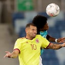 Colombia's Edwin Cardona, left, and Ecuador's Angelo Preciado head for the ball during a Copa America soccer match at Arena Pantanal stadium in Cuiaba, Brazil, Sunday, June 13, 2021. (AP Photo/Andre Penner)