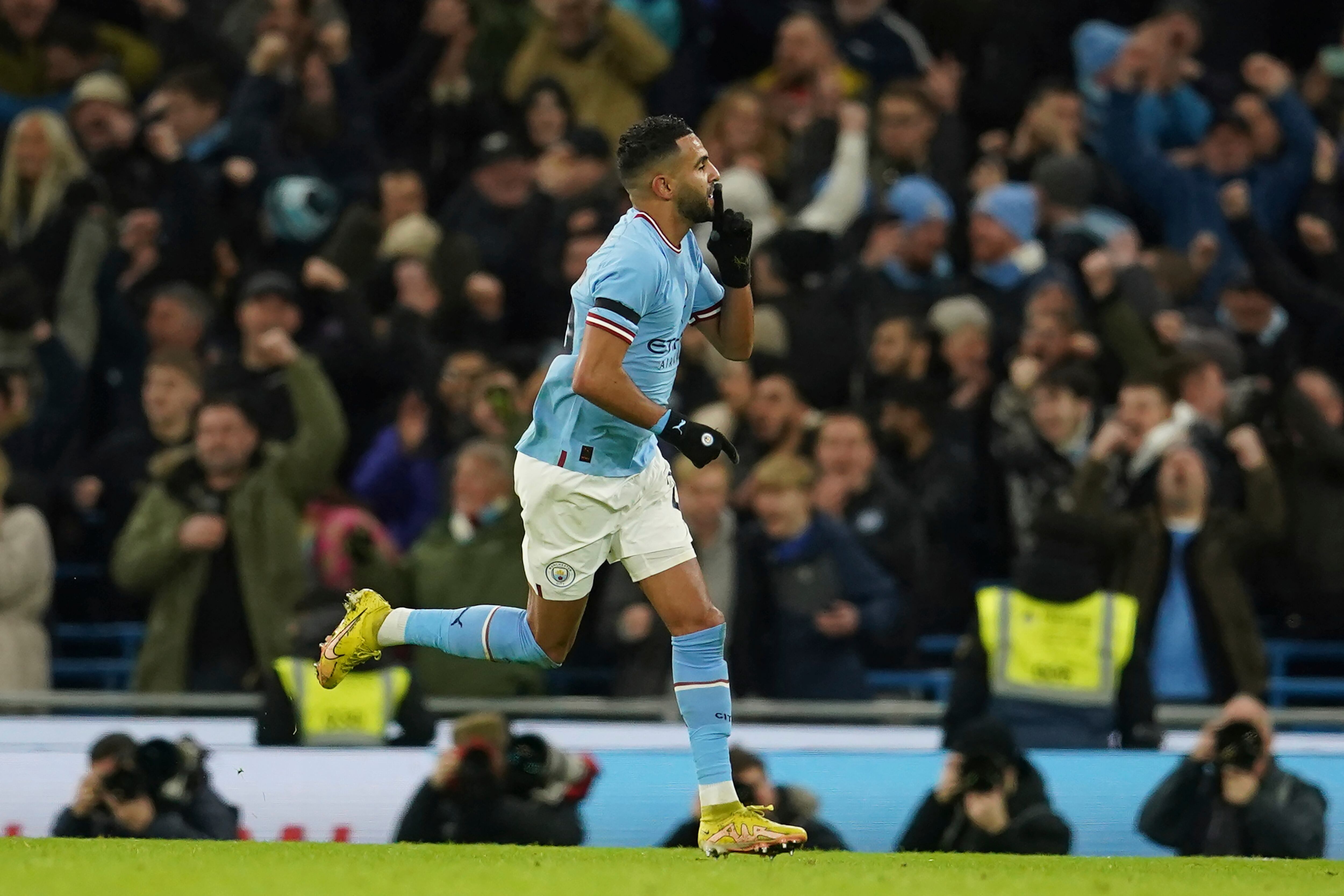 Manchester City's Riyad Mahrez celebrates after scoring his side's opening goal during the English FA Cup soccer match between Manchester City and Chelsea at the Etihad Stadium in Manchester, England, Sunday, Jan. 8, 2023. (AP Photo/Dave Thompson)