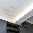 Roof leakage, water dameged ceiling roof and stain on ceiling close-up
