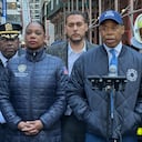 New York Police commissioner Keechant Sewell stands next to New York Mayor Eric Adams as he speaks on the scene of a parking garage that collapsed in lower Manhattan, New York City, on April 18, 2023. (Photo by Peter GERBER / AFP)