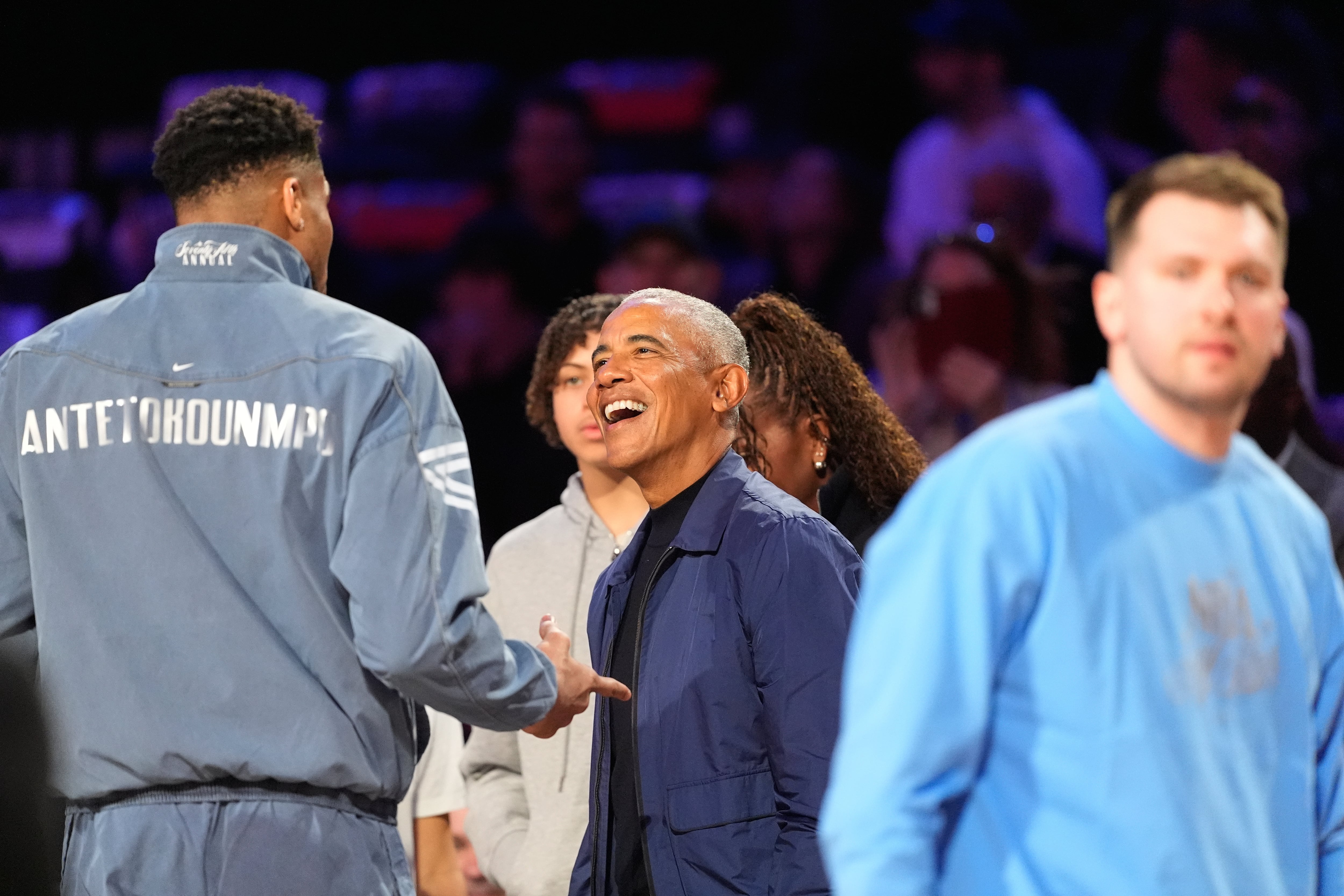 Barack Obama talks to World forward Giannis Antetokounmpo, of Greece, before the NBA All-Star basketball game Sunday, Feb. 15, 2026, in Inglewood, Calif. (AP Photo/Mark J. Terrill)