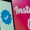 Logo of Instagram social media application and a blue verification checkmark are seen on February 20, 2023 in L'Aquila, Italy. Meta CEO Mark Zuckerberg announced the launch of a paid subscription starting at $11.99 per month for users to authenticate their profiles on Meta platforms (Facebook, Instagram). (Photo by Lorenzo Di Cola/NurPhoto via Getty Images)