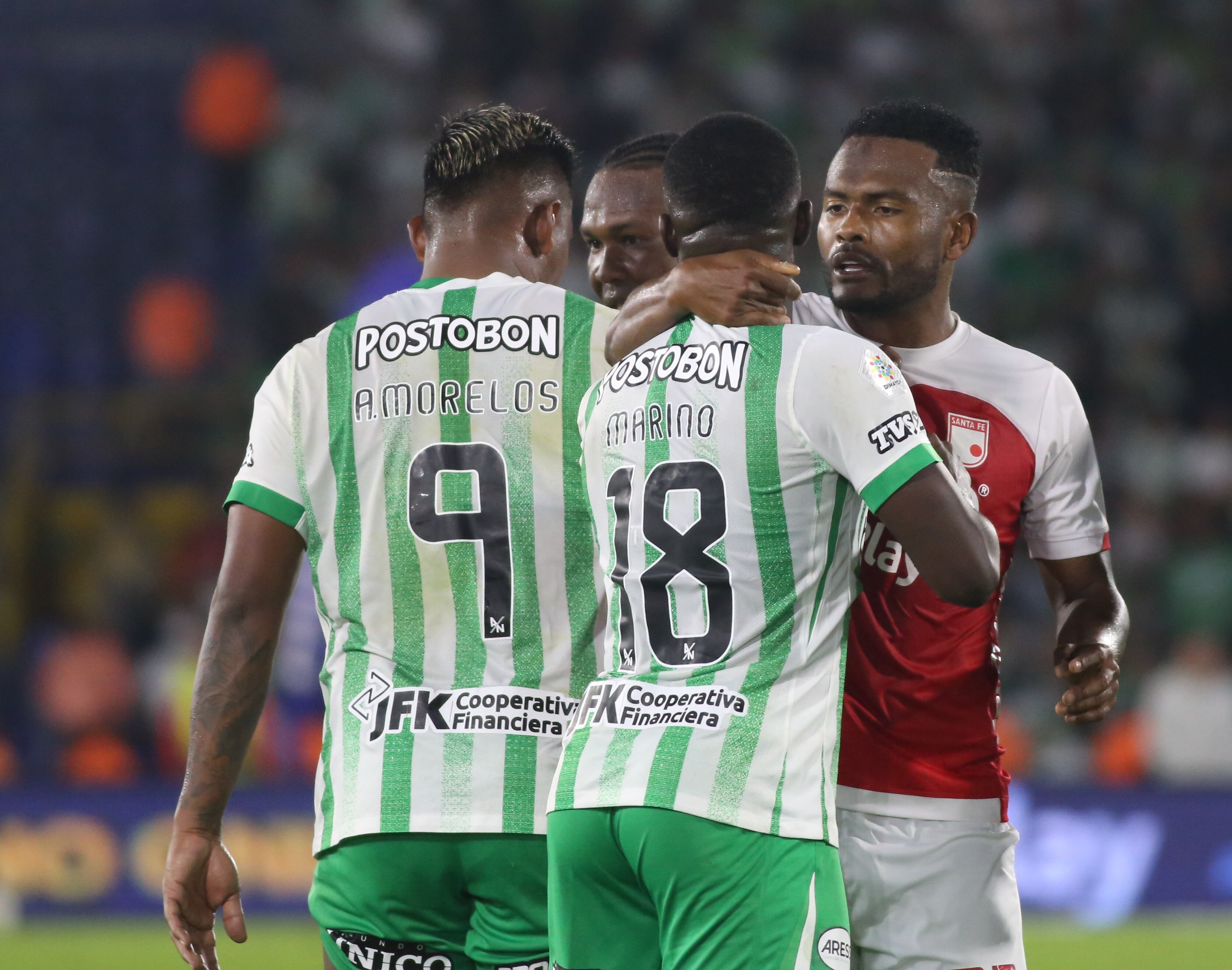 Elvis Perlaza of Independiente Santa Fe and Marino Hinestroza of Atletico Nacional speak during the match between Independiente Santa Fe and Atletico Nacional for Matchday 4, the semifinal quadrangular matches, as part of the Liga BetPlay DIMAYOR I 2025, played at the Nemesio Camacho El Campin stadium in Bogota, Colombia. (Photo by Daniel Garzon Herazo/NurPhoto via Getty Images)
