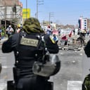 A riot policeline fases demonstrators blocking the Pan-American highway demanding the resignation of the President of Peru, Dina Boluarte at La Joya, Arequipa Region in southern Peru, on January 6, 2023. - Political upheaval has roiled Peru since then-president Pedro Castillo in early December sought to dissolve Congress and rule by decree, only to be ousted and thrown in jail. Castillo's was replaced by his vice president, Dina Boluarte, who since then has faced a wave of often violent demonstrations calling for his return to power. (Photo by Diego Ramos / AFP)